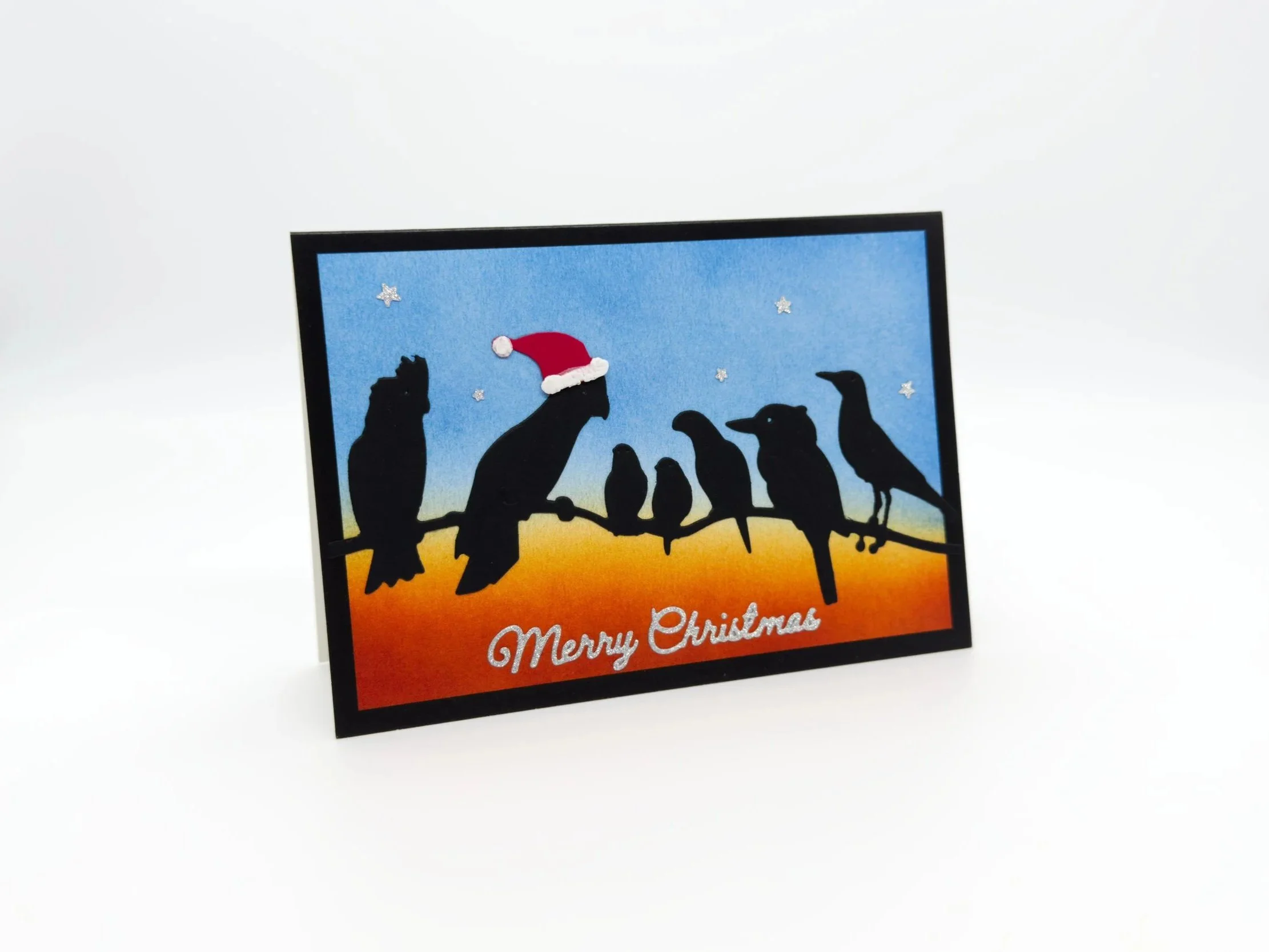 Seven birds on branch dusk christmas