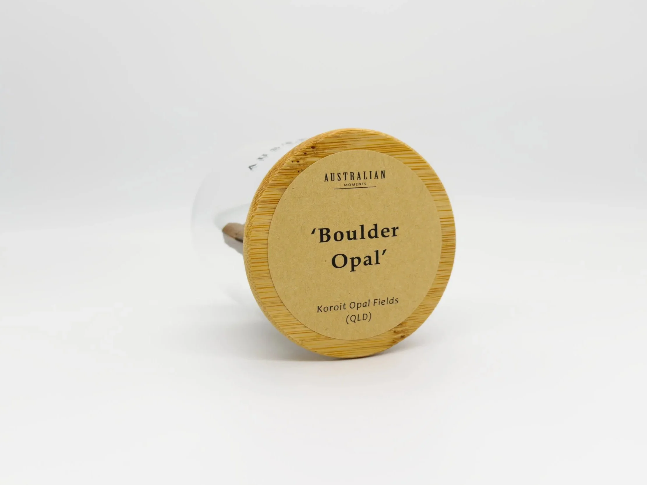 Boulder opal section in glass jar