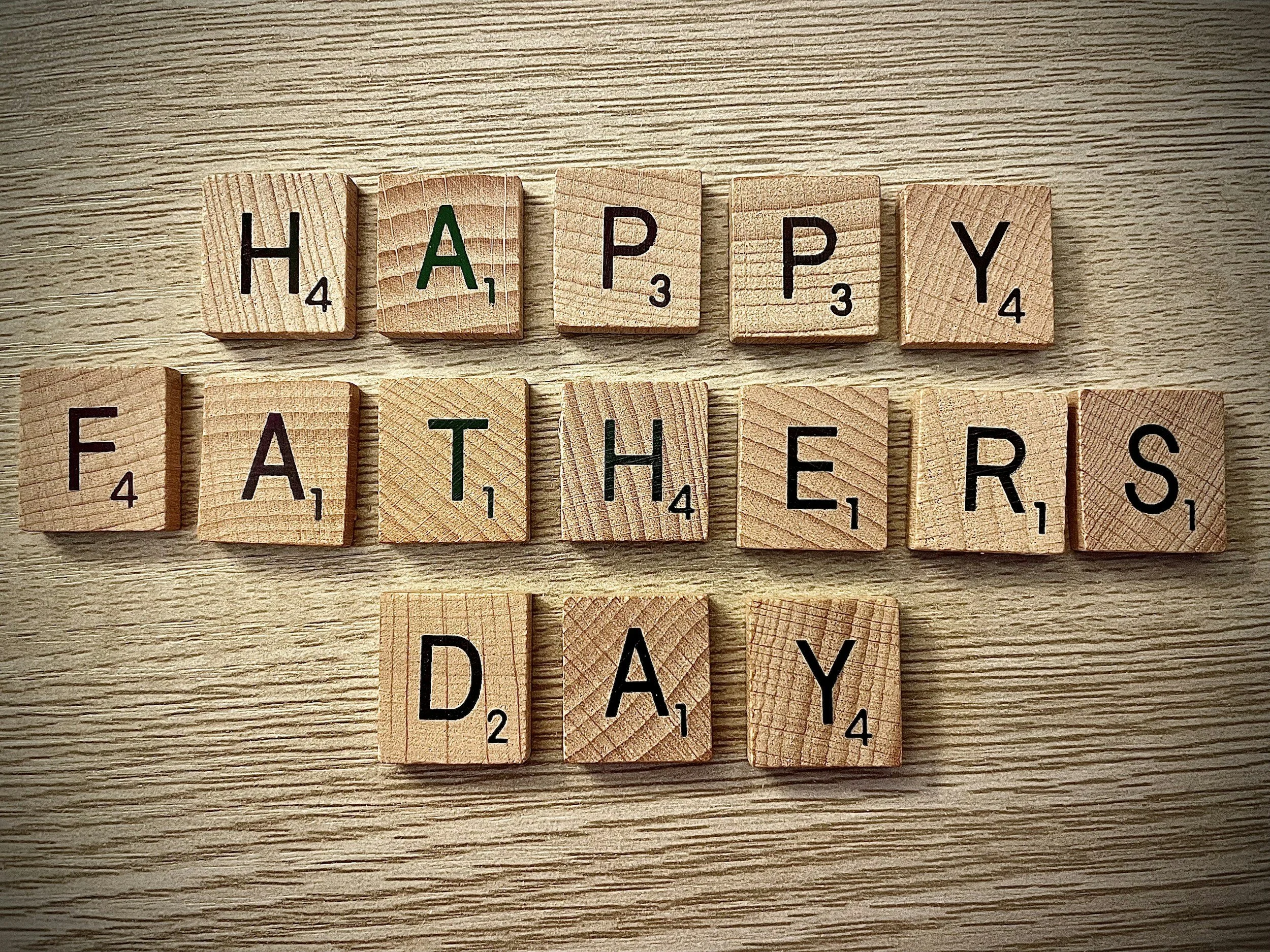 Scrabble tiles that spell out Happy Fathers Day