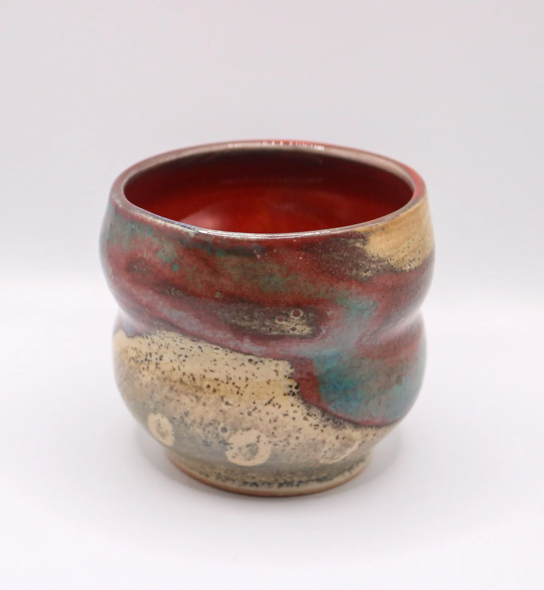 wheel thrown cup | shino glaze with oribe brush on reduction-fired porcelain | 2025