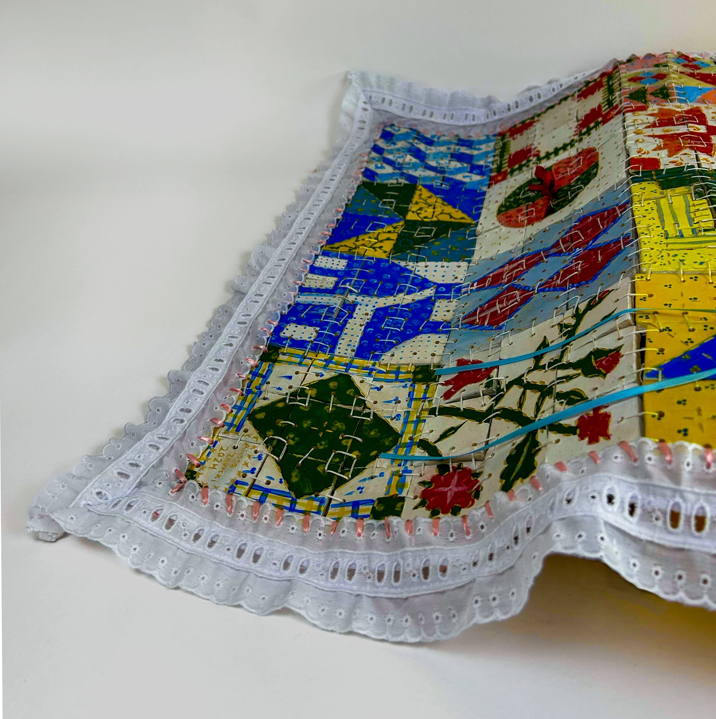 Collective Consciousness: A Labor of Love | stoneware, underglaze, PE braid, fabric trim, and ribbon | 2024