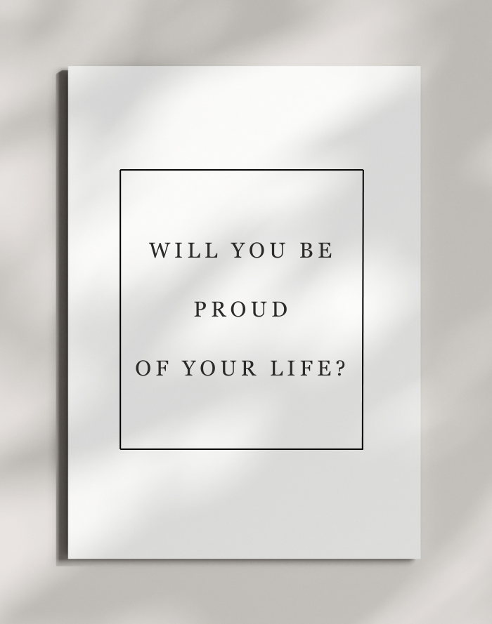 Worksheet with black text reading 'Will you be proud of your life?' framed by a thin black rectangle, placed on a light-colored surface.