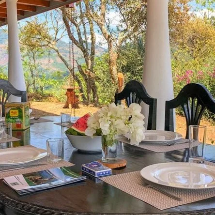 Shared meals and meaningful conversation overlooking the valley.