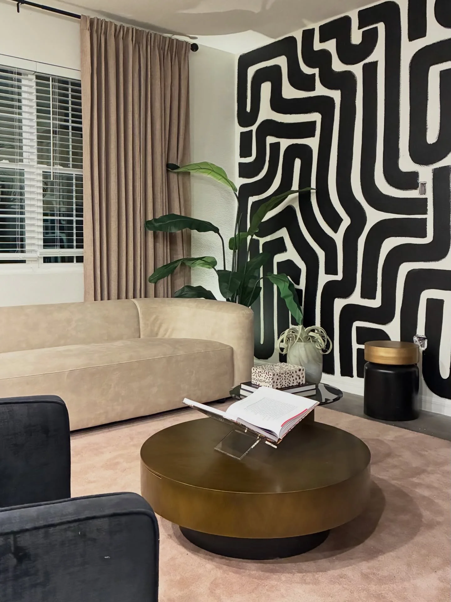 Remember, a few years back, when I freehand painted a mural in my dining nook? 

Well, my client saw it and decided her living room needed a similar bold energy and, I must say, that was the best decision we made for that space. 

Compared to mine, I