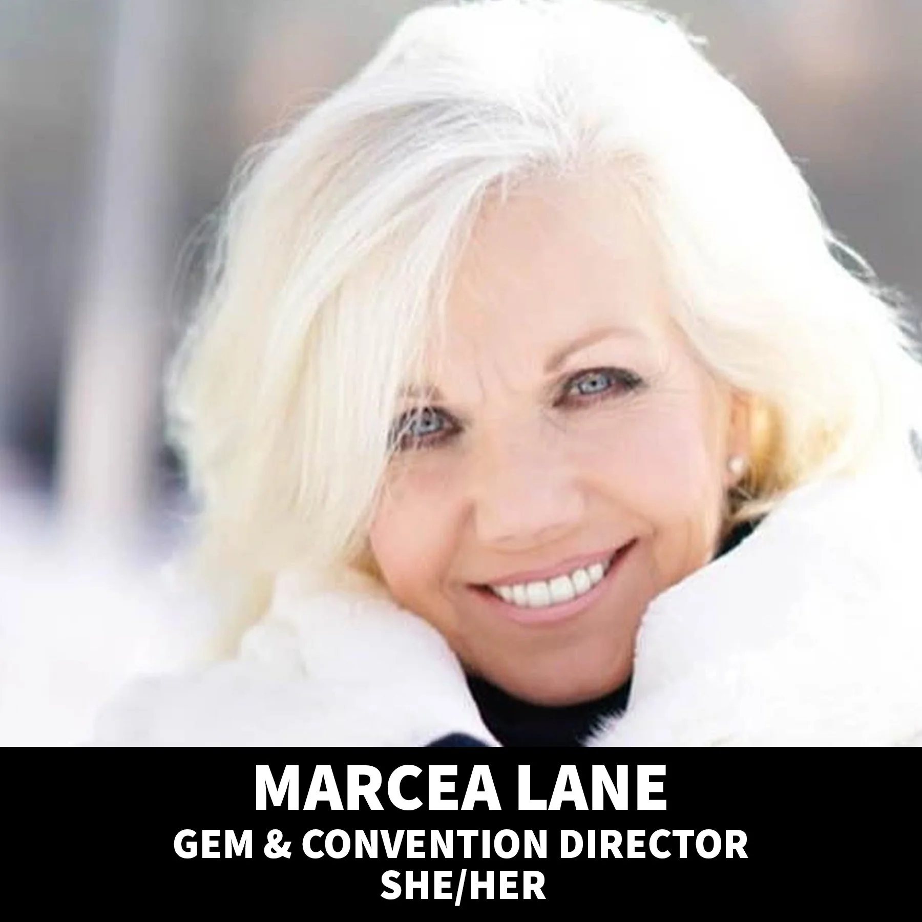 Close-up portrait of a smiling older woman with white hair, dressed warmly, with a blurred background. Text overlay includes her name, Marcea Lane, her role as convention director, and her pronouns she/her.