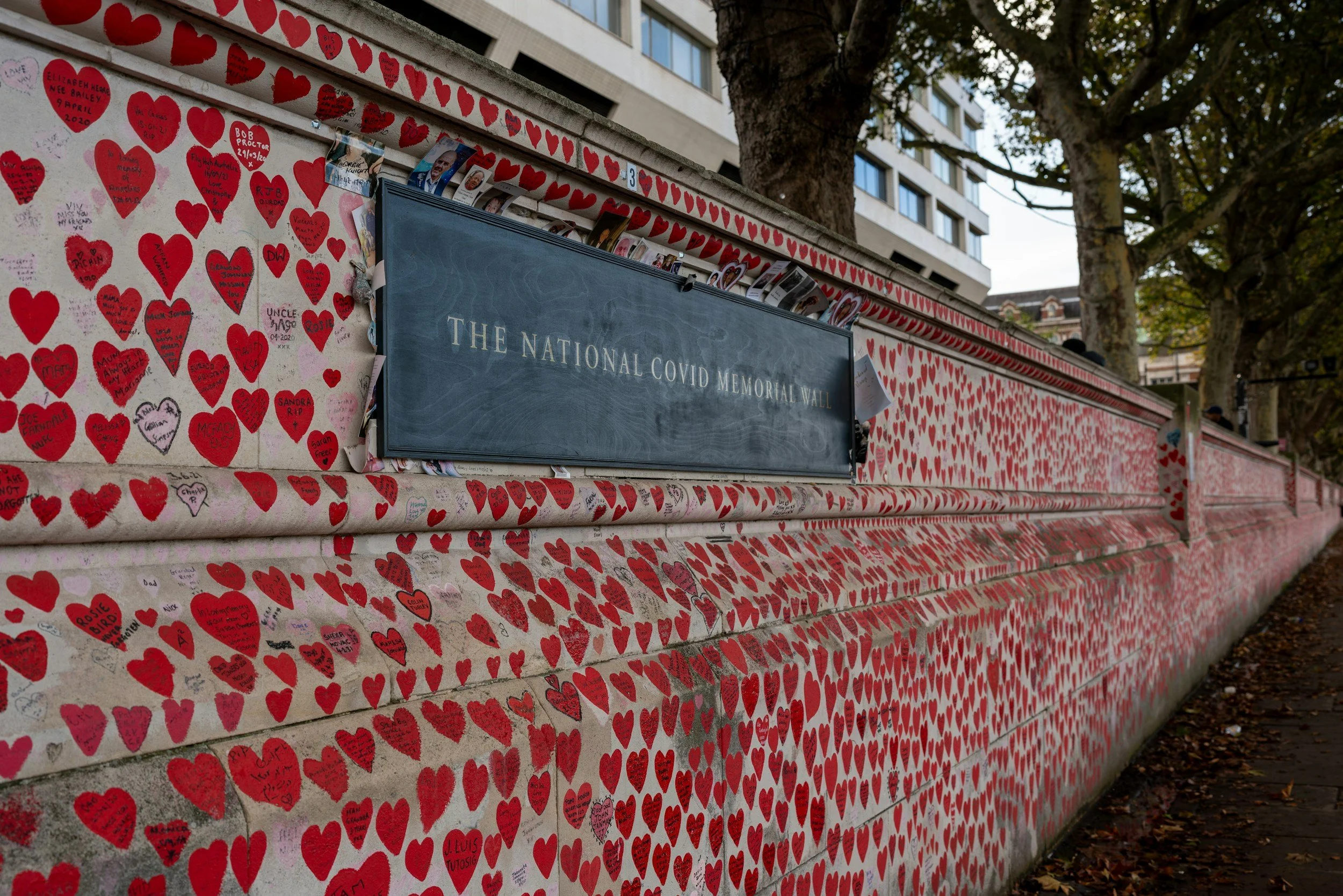 cemetery wall with red hearts