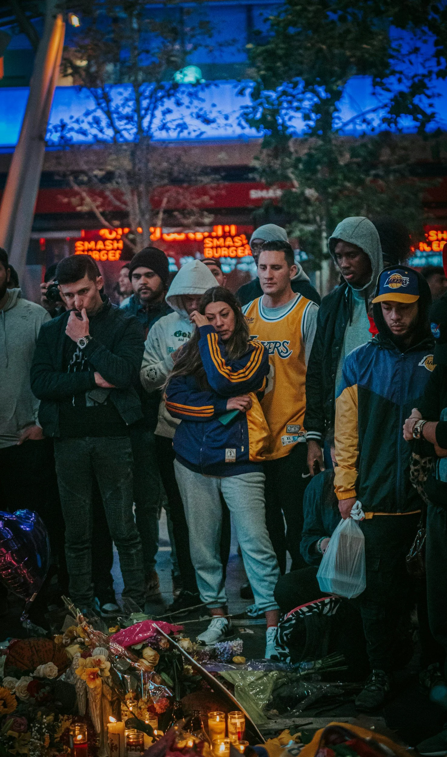 people standing at a memorial for kobe bryant