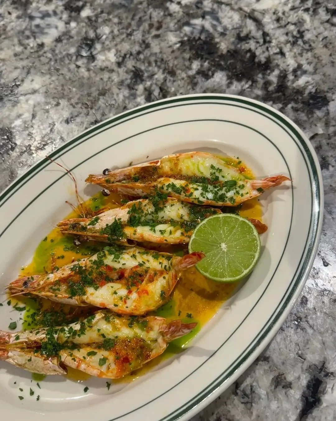 Fallow's wood roasted Shark Bay prawns, yuzu kosho butter.