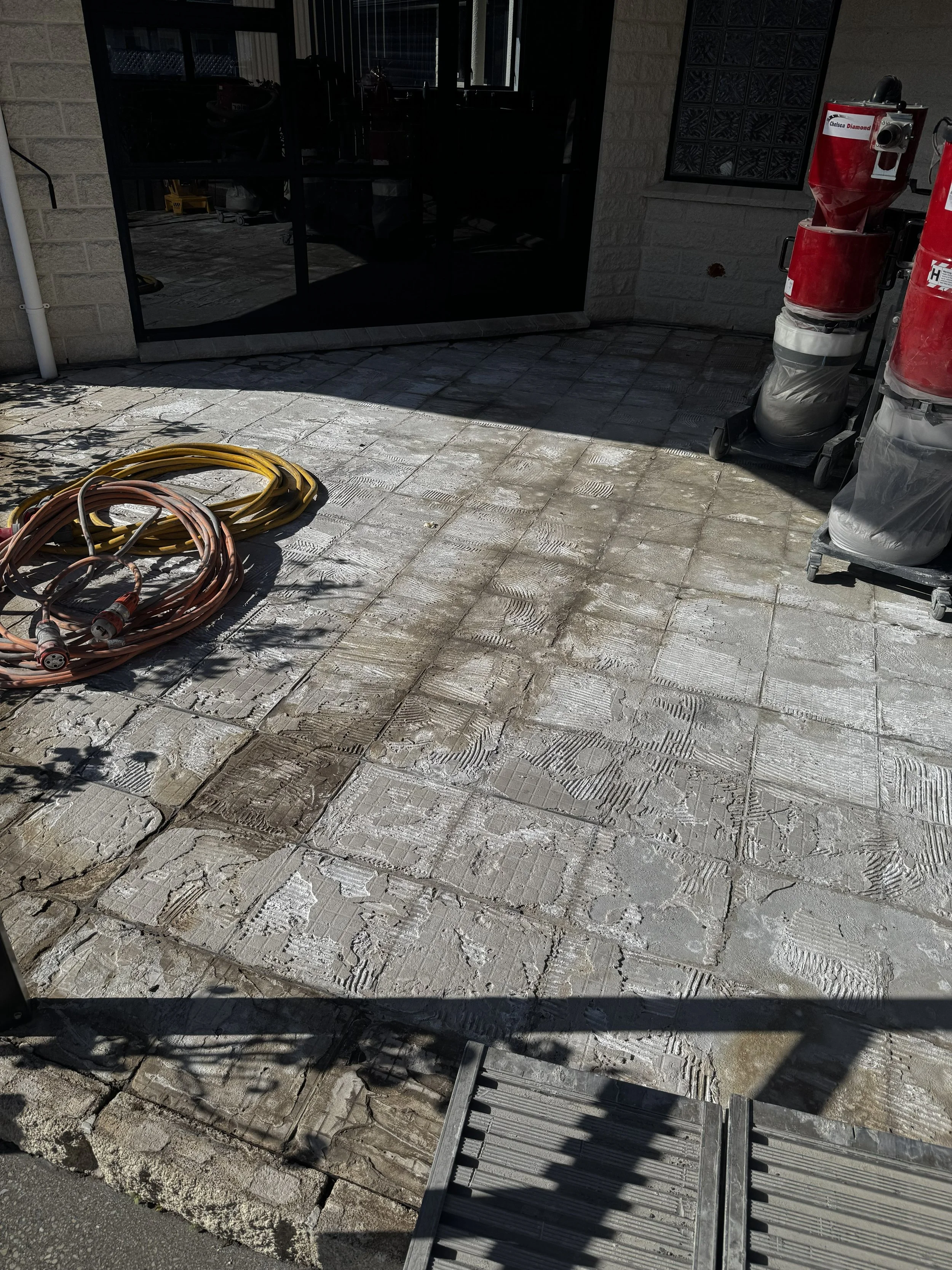 Concrete Deck with tile glue on it
