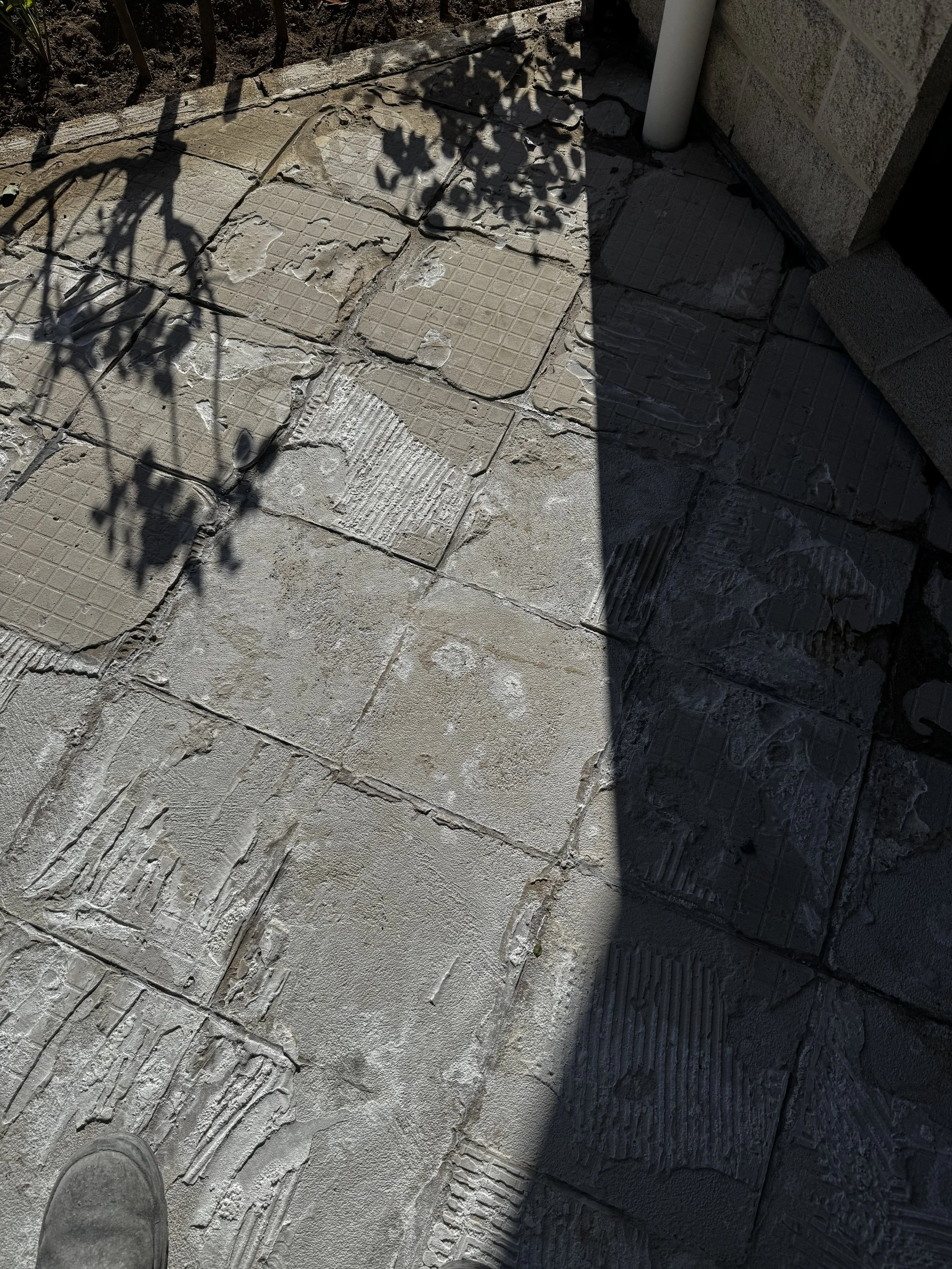 Concrete Deck with tile glue on it