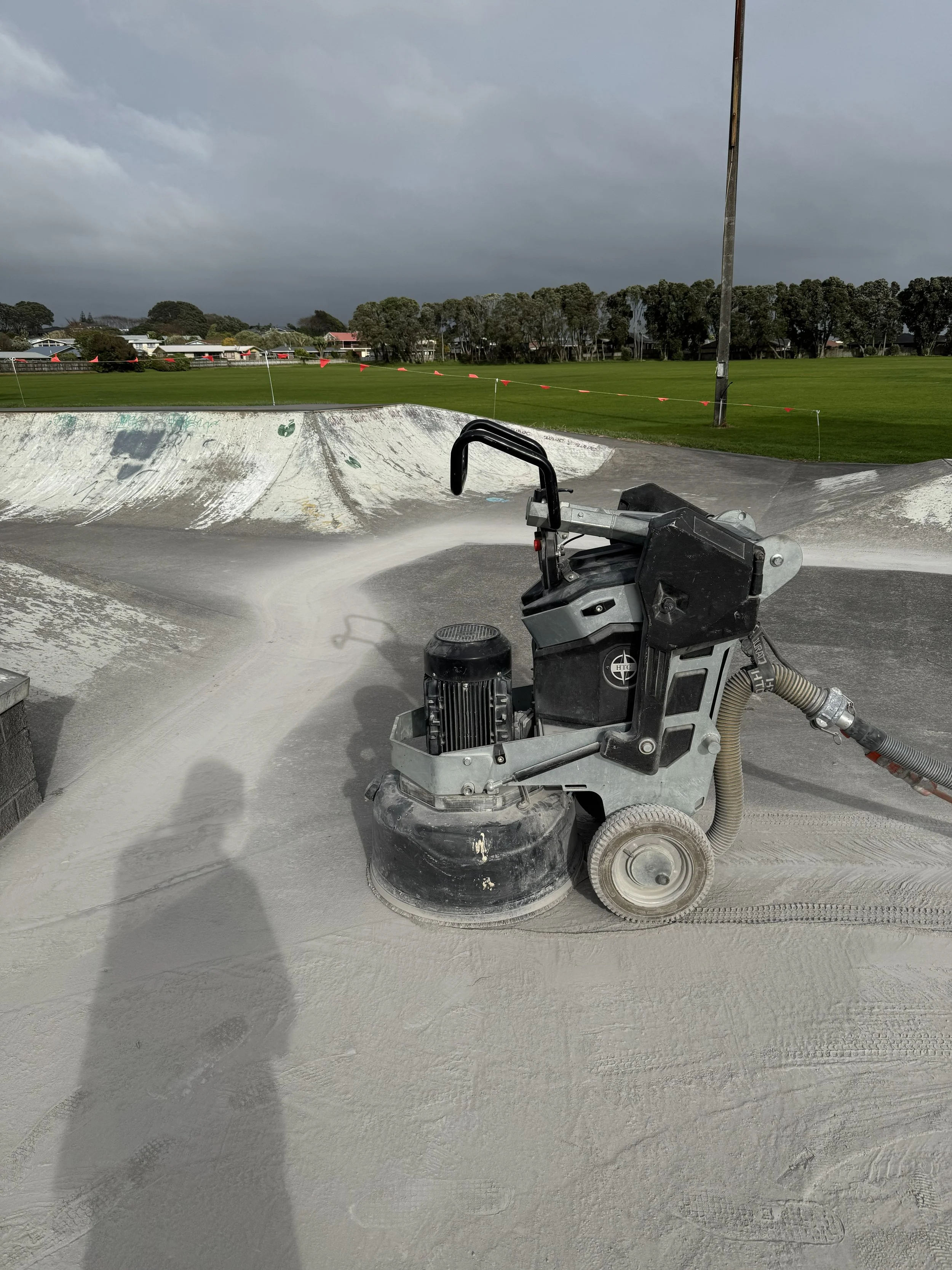 smoothing concrete at a skate park