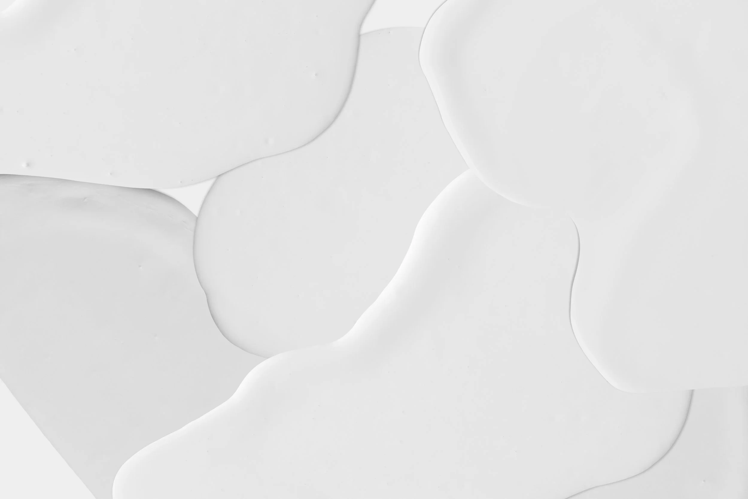 White paint splashes on white background