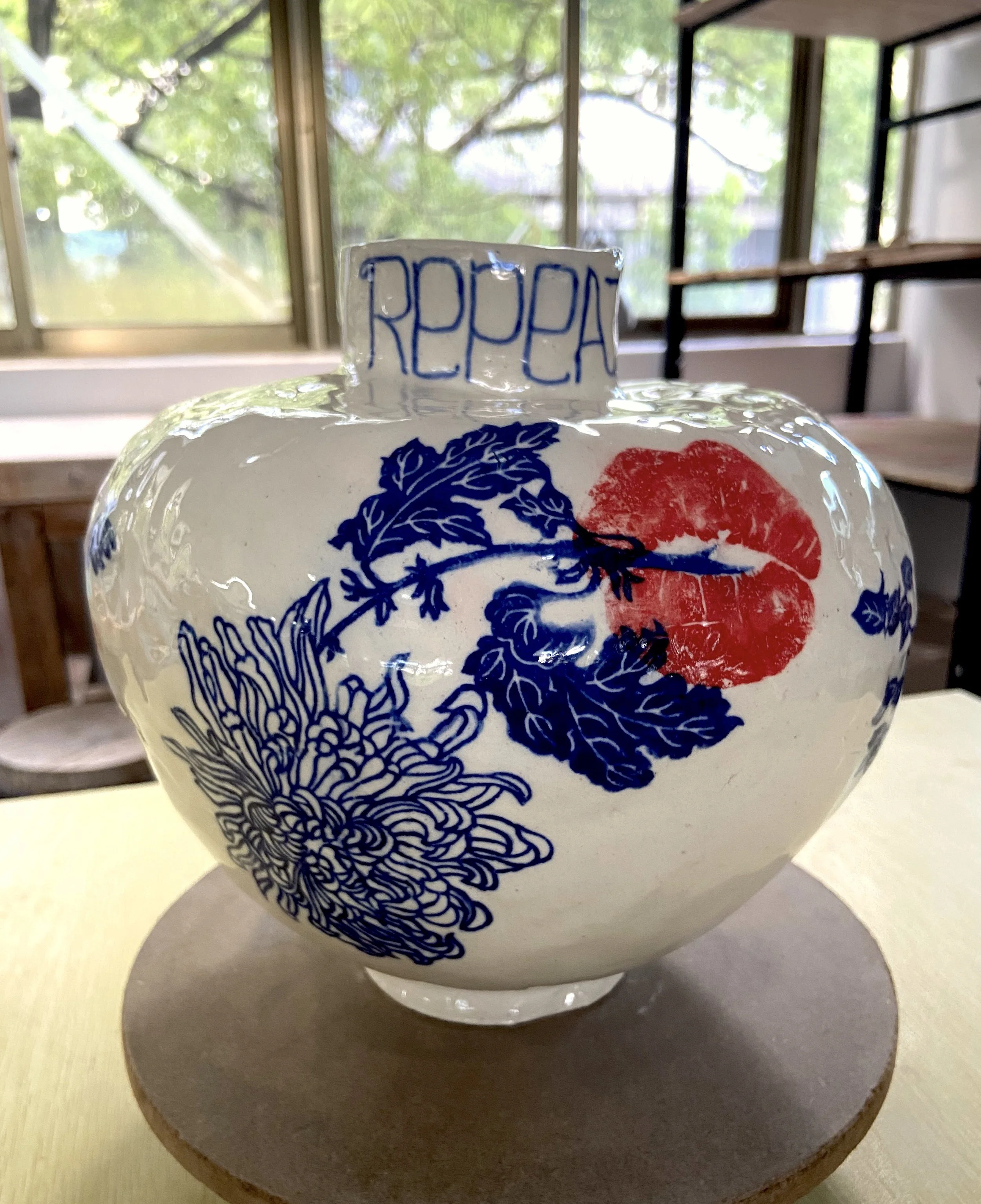 "Live, love, create, repeat" Moonjar. White Stoneware. Traditional transfers & underglaze pen. H42cm x W39cm x D25cm. 2025