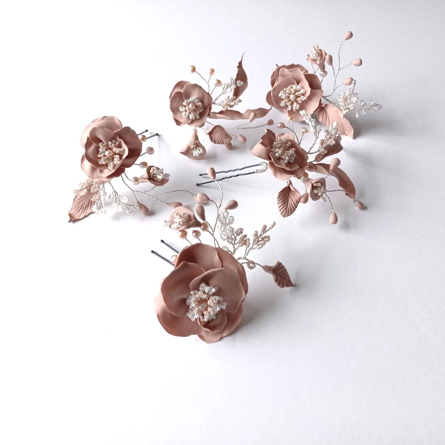 A custom made Antique Pink floral hair accessory for Amy