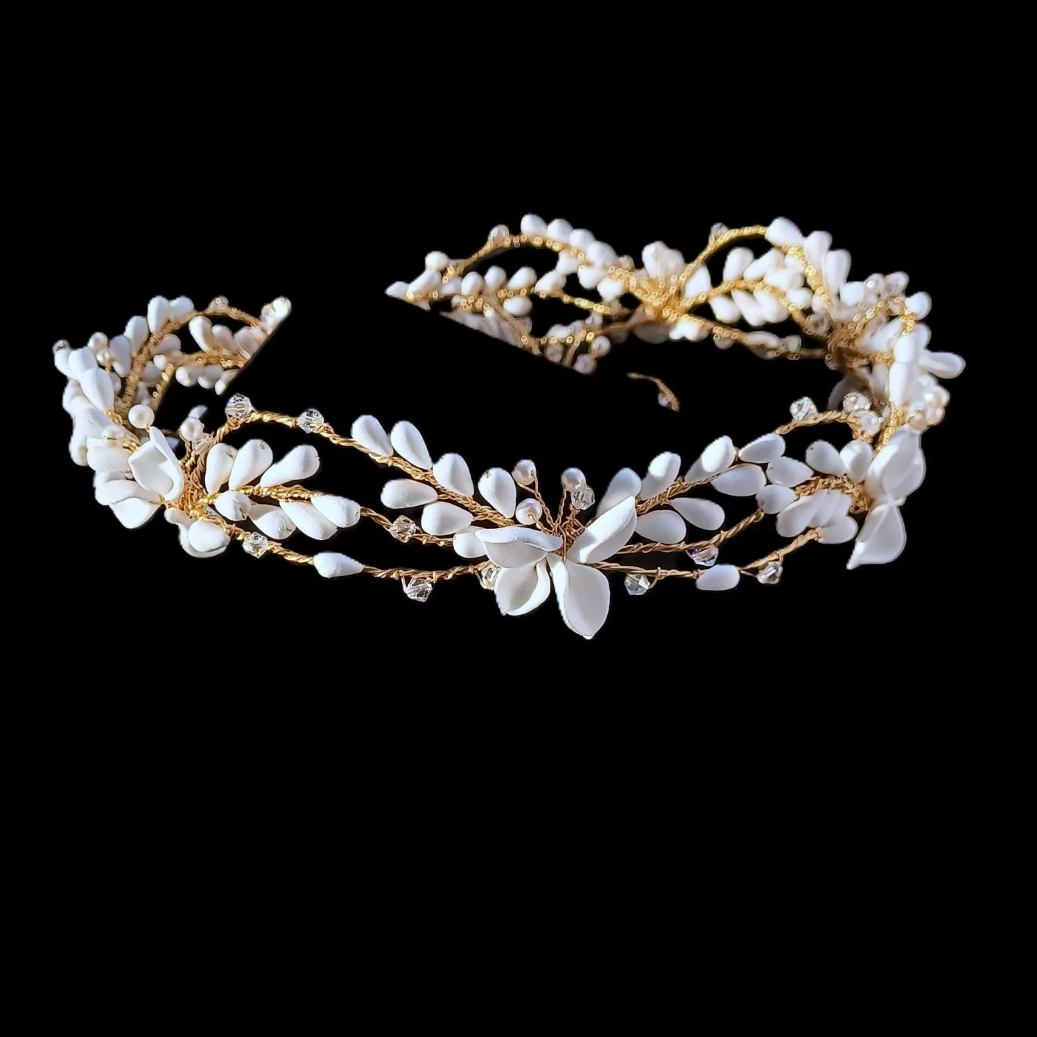 soft matt white bridal crown with handmade clay flowers and petals perfect for bohemian weddings and garden wedding celebrations