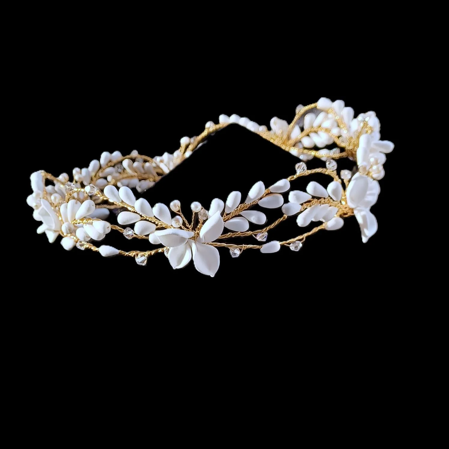 soft matt white bridal crown with handmade clay flowers and petals perfect for bohemian weddings and garden wedding celebrations