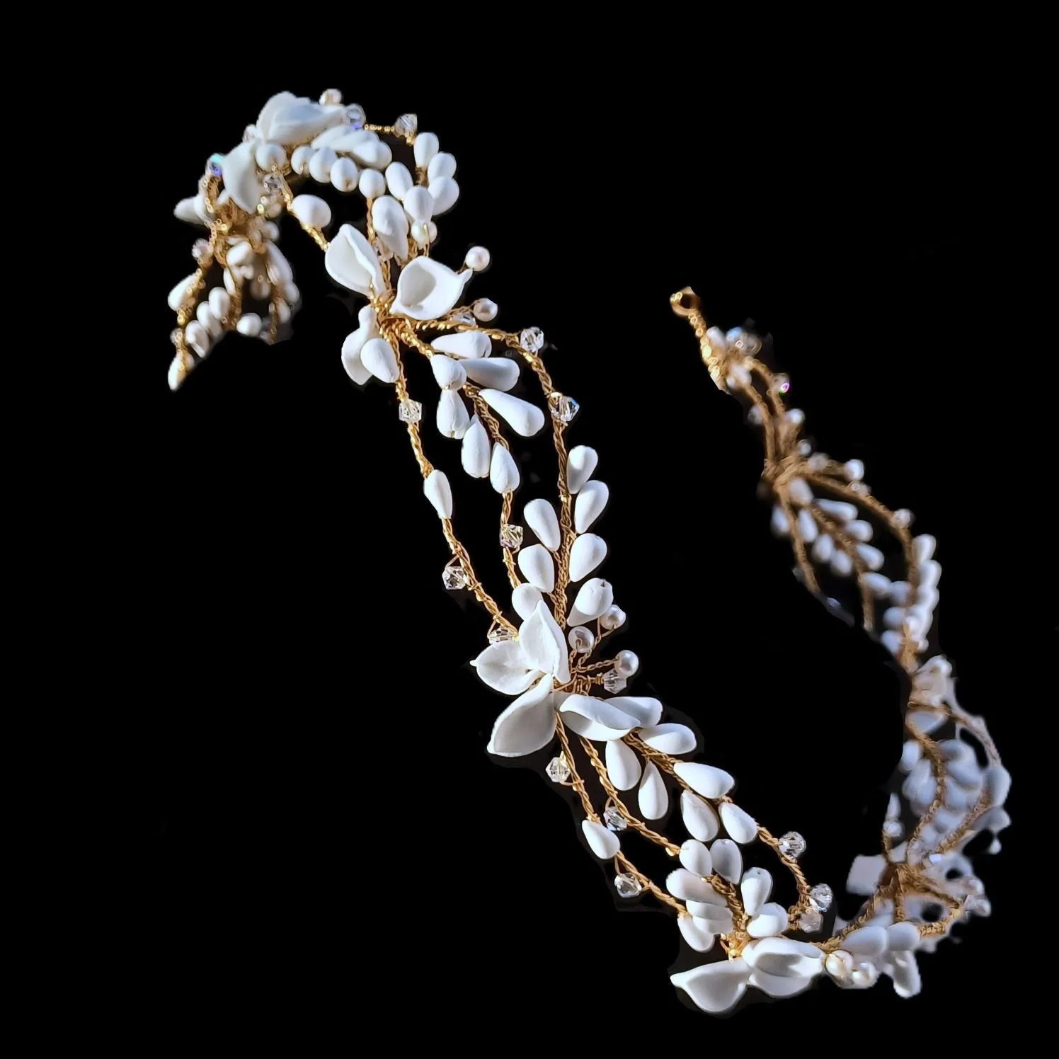 soft matt white bridal crown with handmade clay flowers and petals perfect for bohemian weddings and garden wedding celebrations