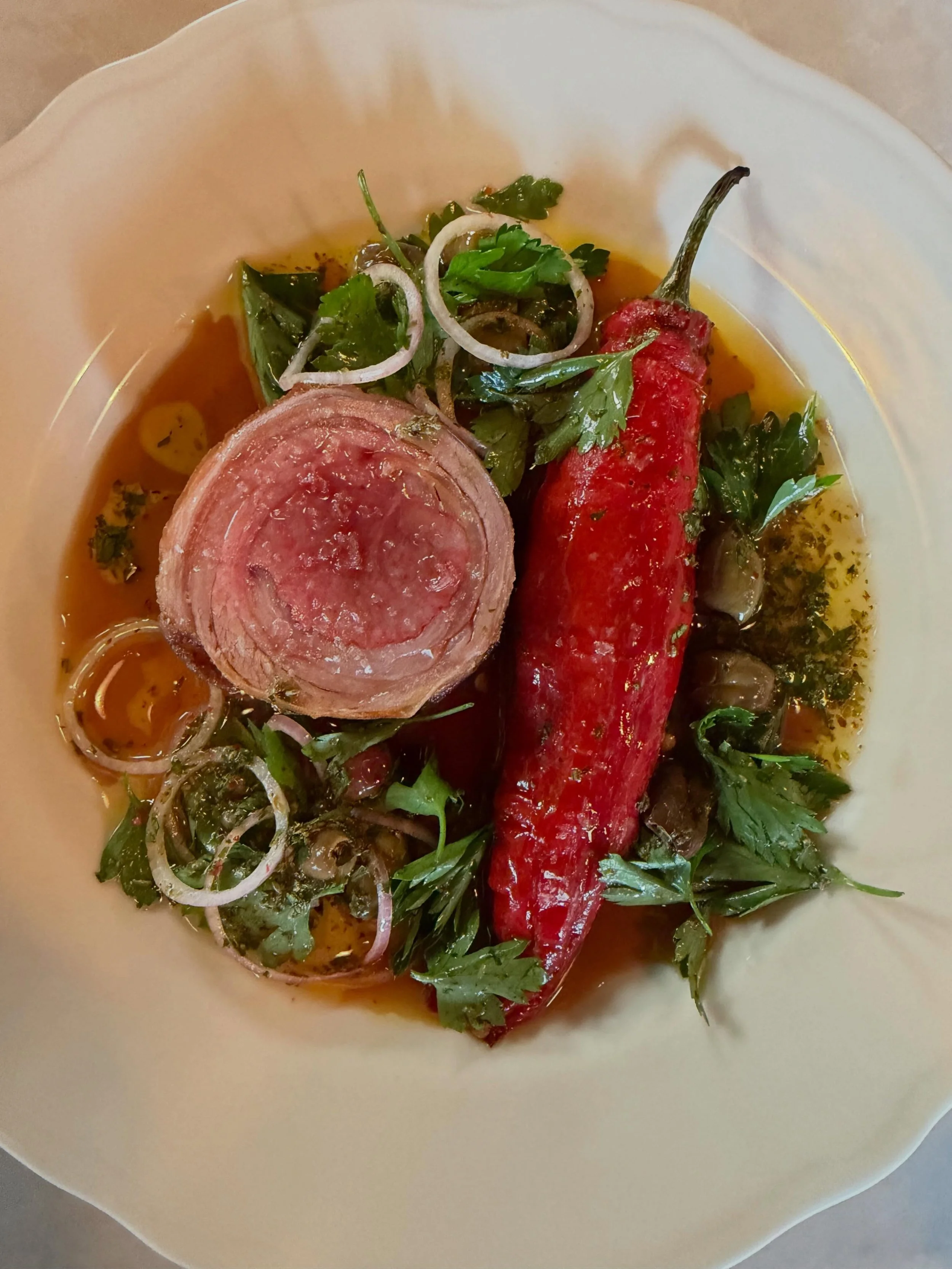 Our lamb comes in whole from our friends @hiddenstreamfarm and is broken down by our kitchen team. We thoughtfully use all parts of the animals we bring in. For this dish, we confit lamb shanks in lamb fat and make a rillettes which fills the pepper.