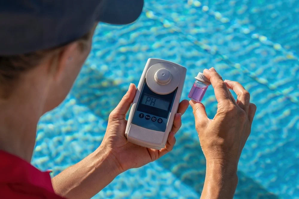 Frank N Pools testing the chemicals in your Pool Water