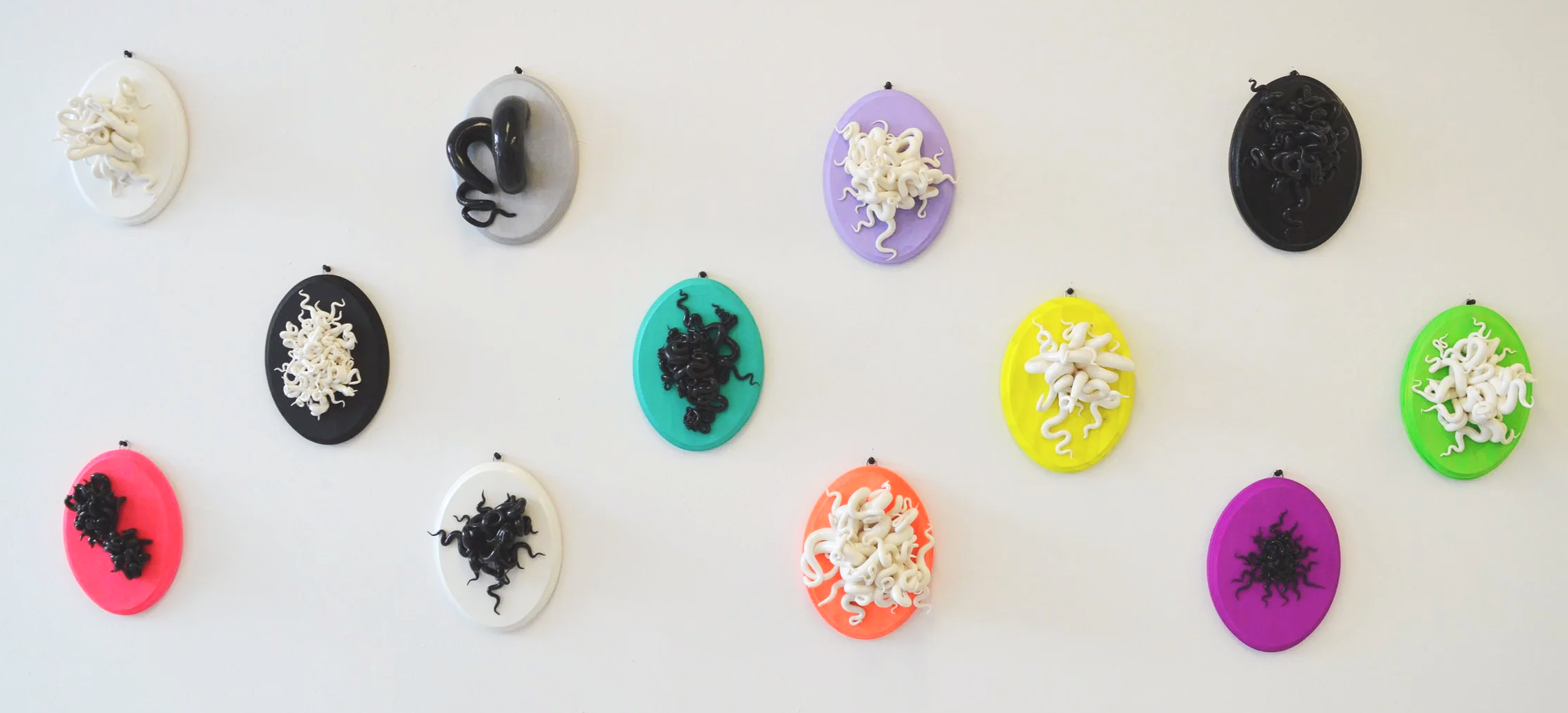 Aesthetic Discomfort, model magic, spray paint, acrylic paint, basswood, high gloss sealant, March 2025, 12 works each 7”x5”