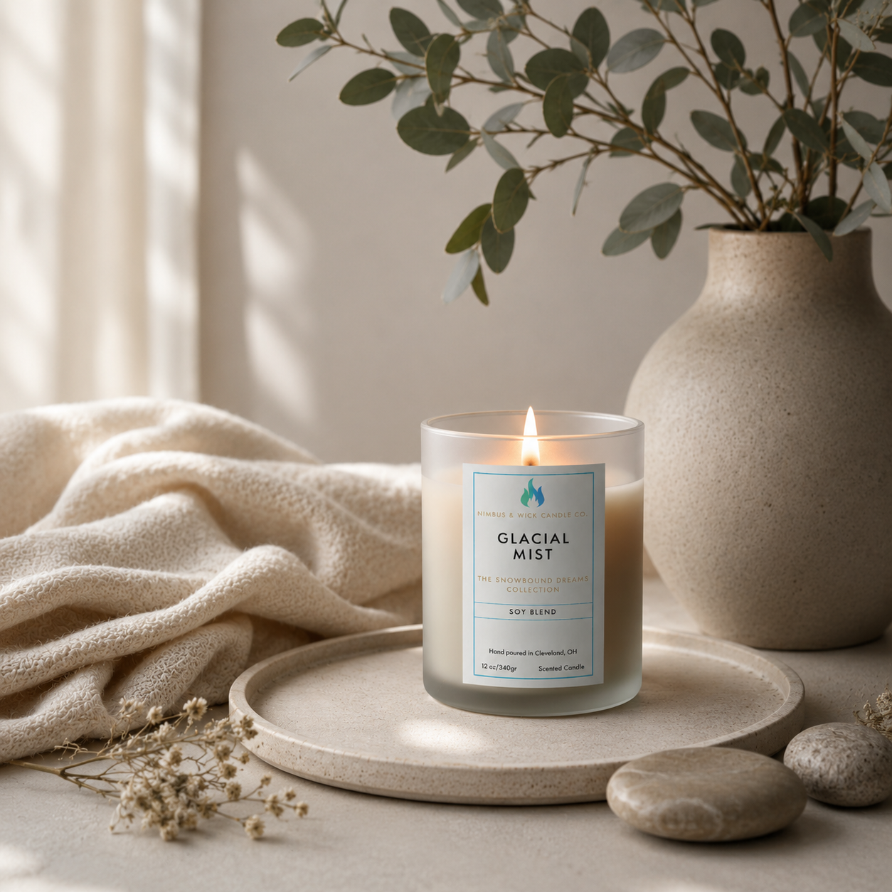 Glacial Mist winter-inspired soy candle with cranberry, red apple, evergreen, vanilla, musk, and fresh winter air fragrance notes.