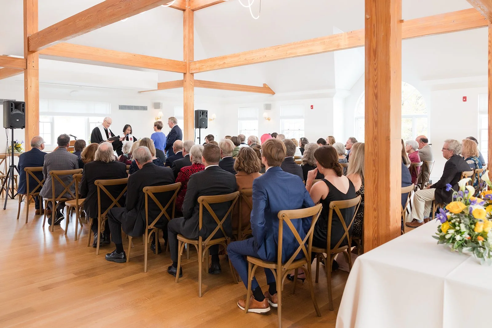 A wedding ceremony on the main level which was converted to a dinner space while guests were enjoying themselves at the downstairs bar.