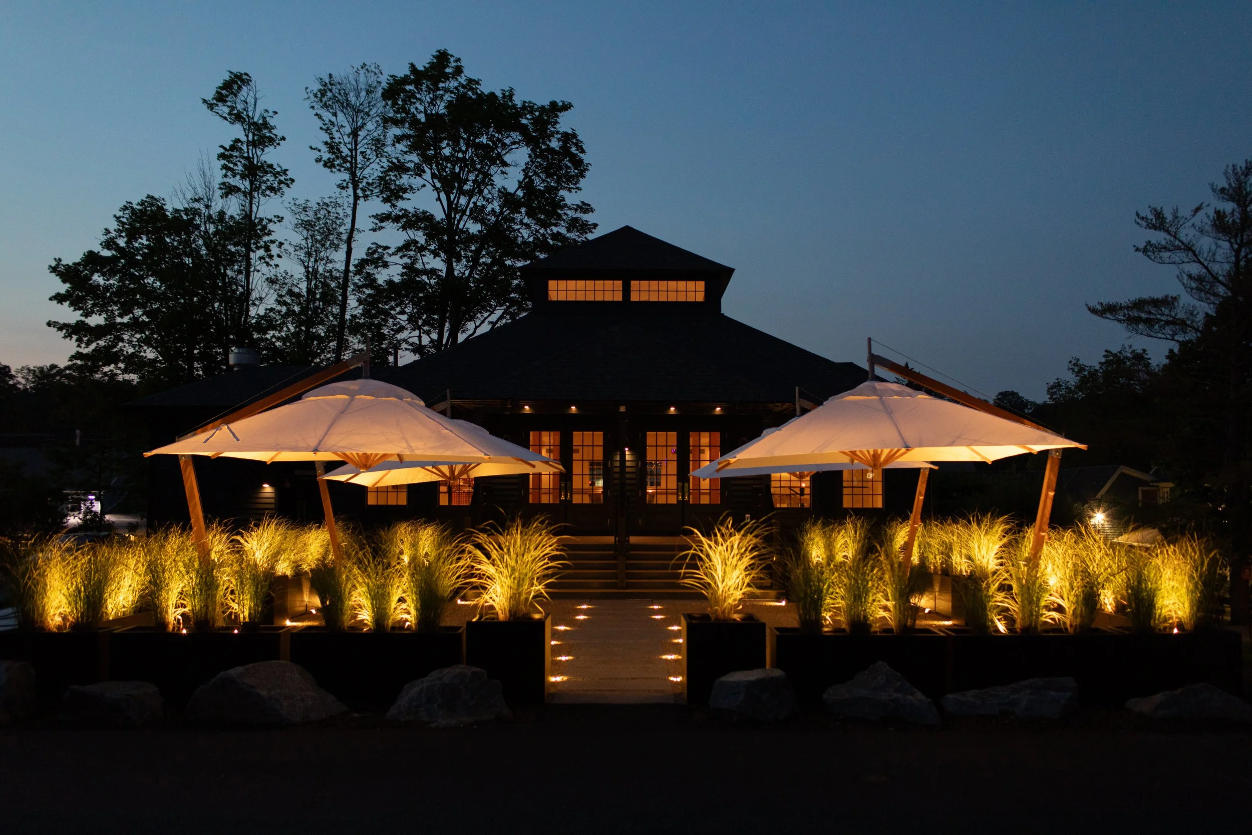 The Belvedere's patio uplit with umbrellas.  The patio is perfect for cocktails or a wedding ceremony.