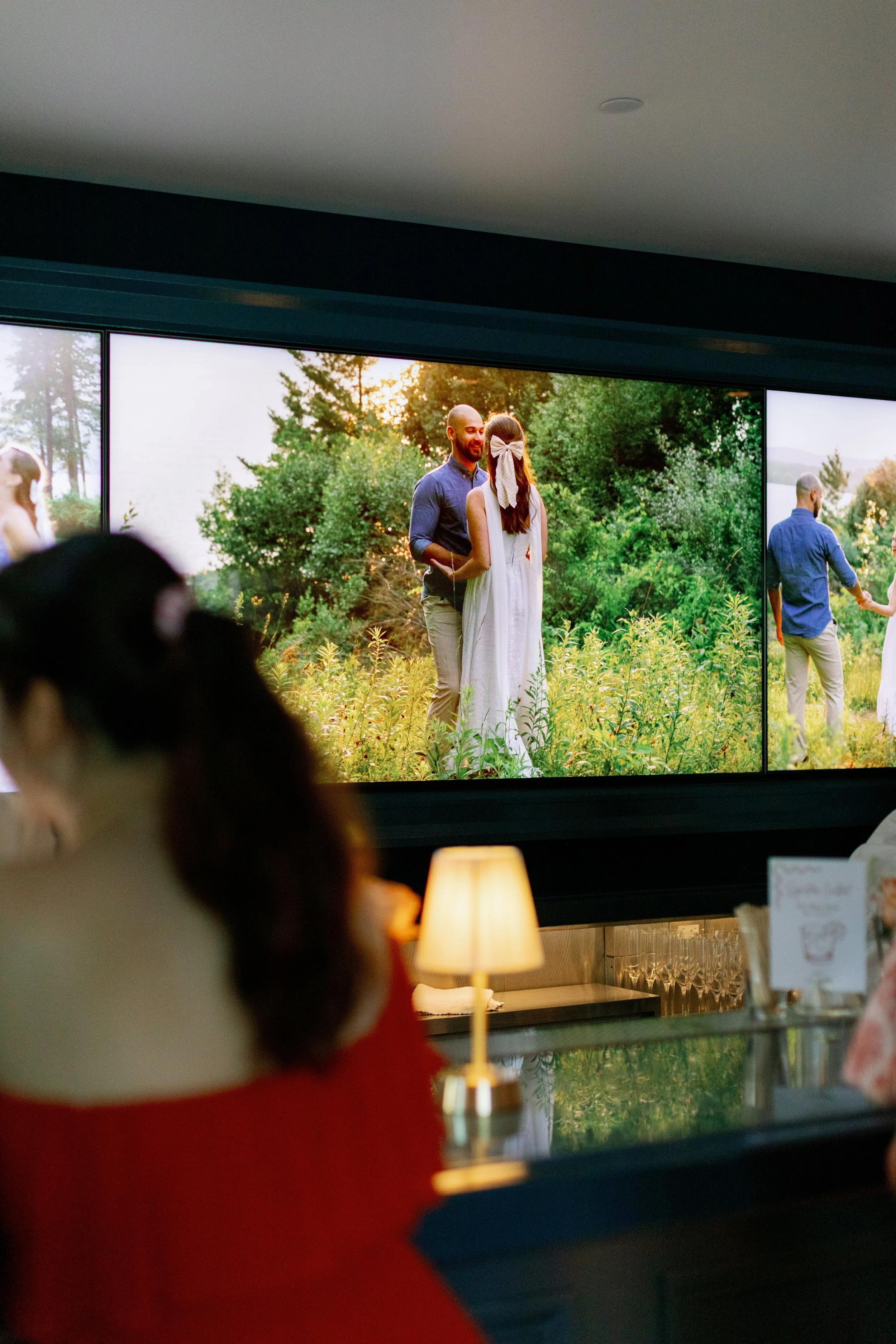 Behind the bar during a wedding cocktail hour, images of the happy couple were shown in a slide show.