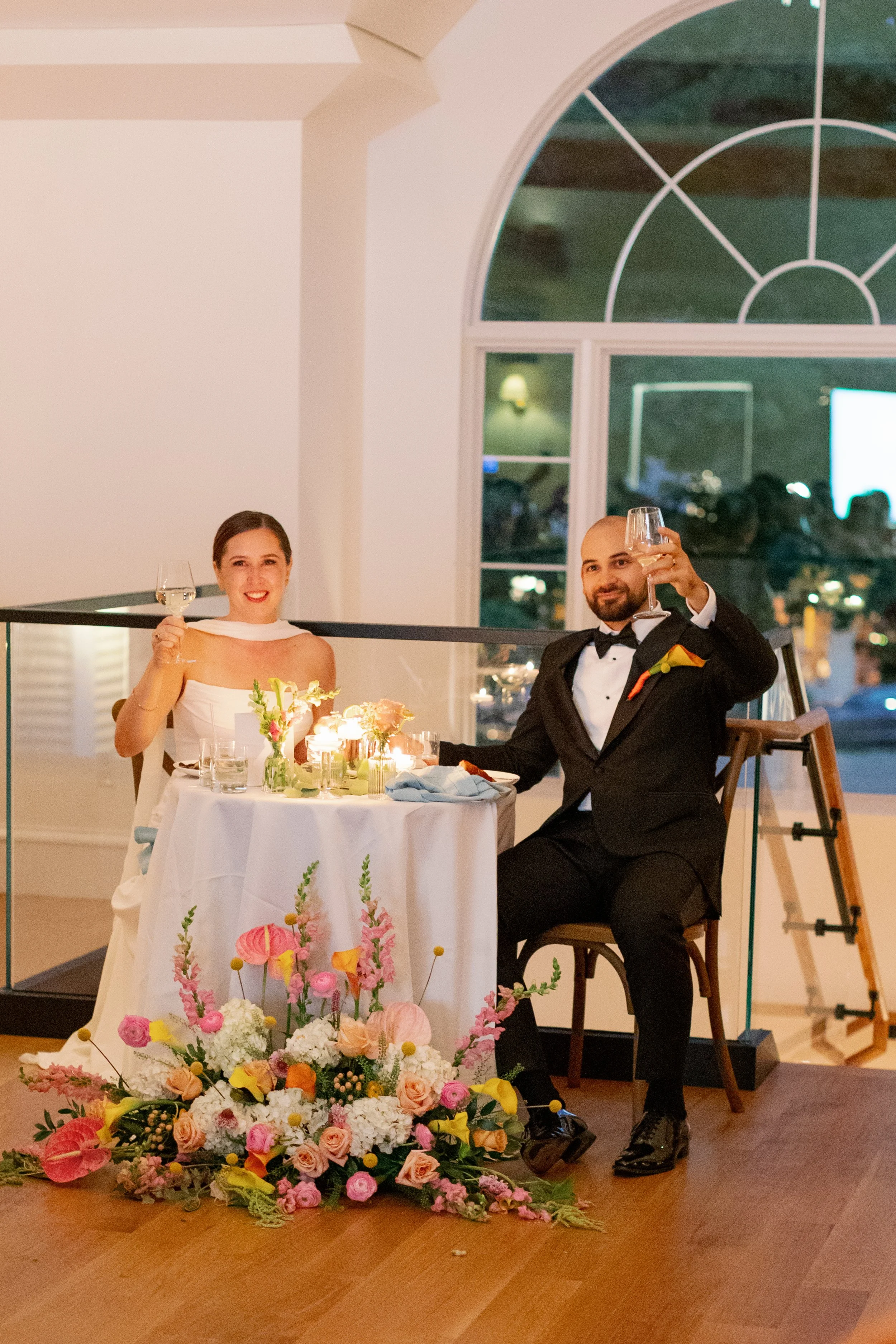 A sweetheart table allowed the bride and groom to see all their guests and to be seen during dinner on the main level! 