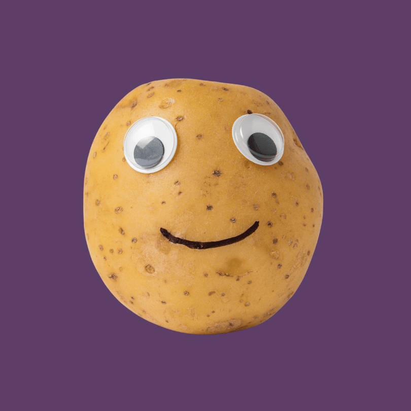 A potato with googly eyes and a drawn smile, set against a purple background.
