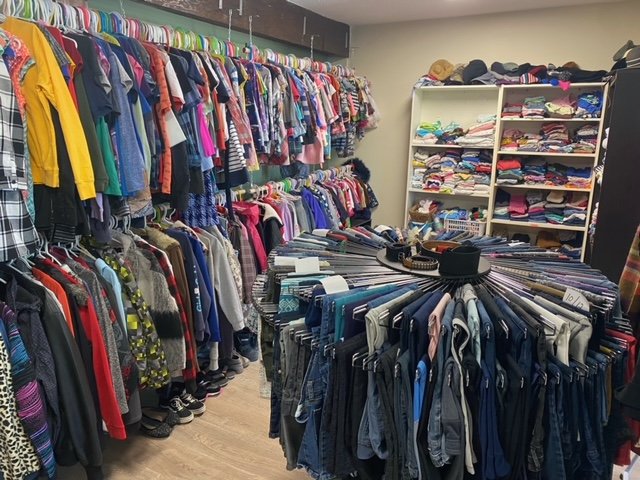 Clothing racks in the interior of boutique.