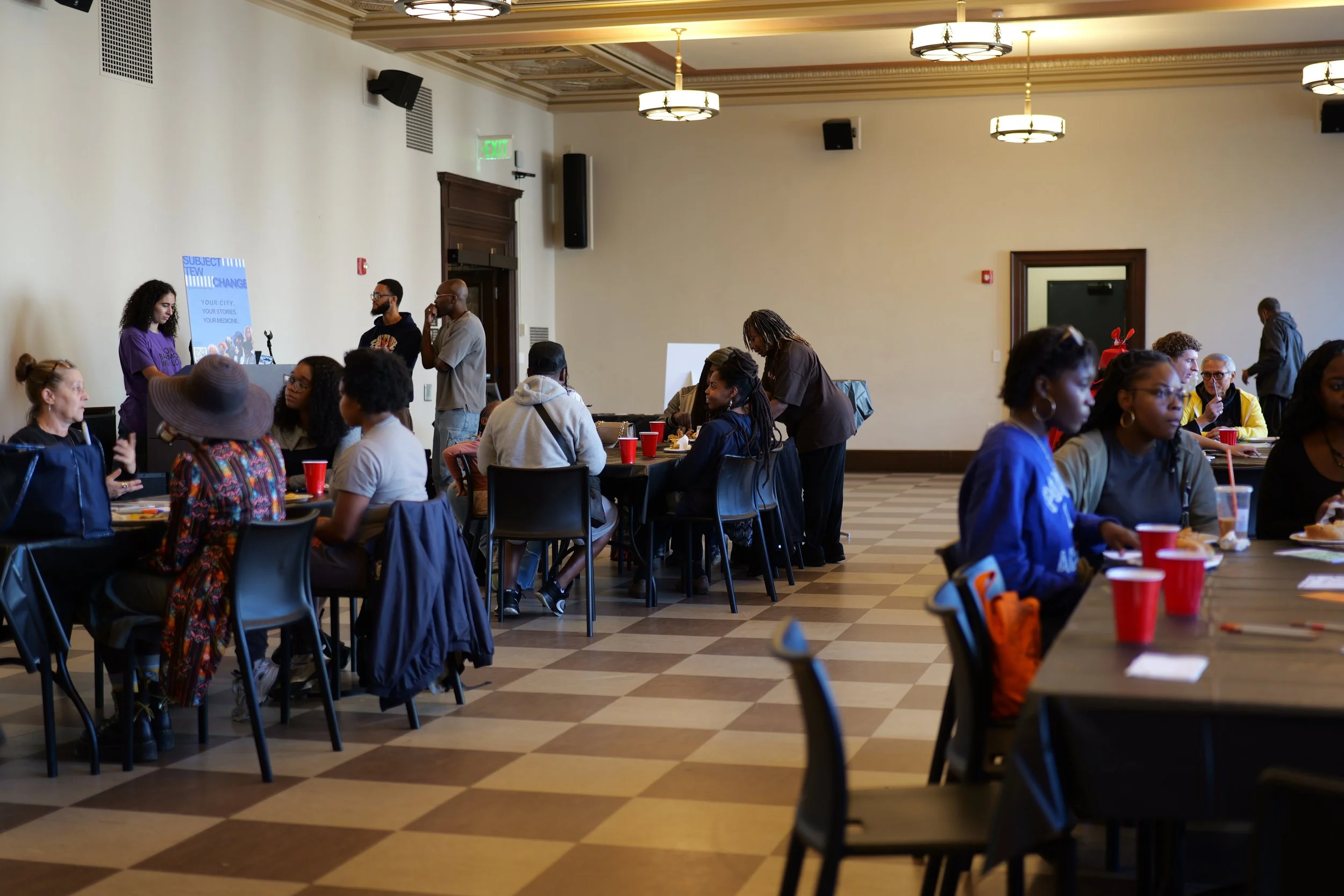 Participants share food and conversation during a Mixing Bowl community gathering.
