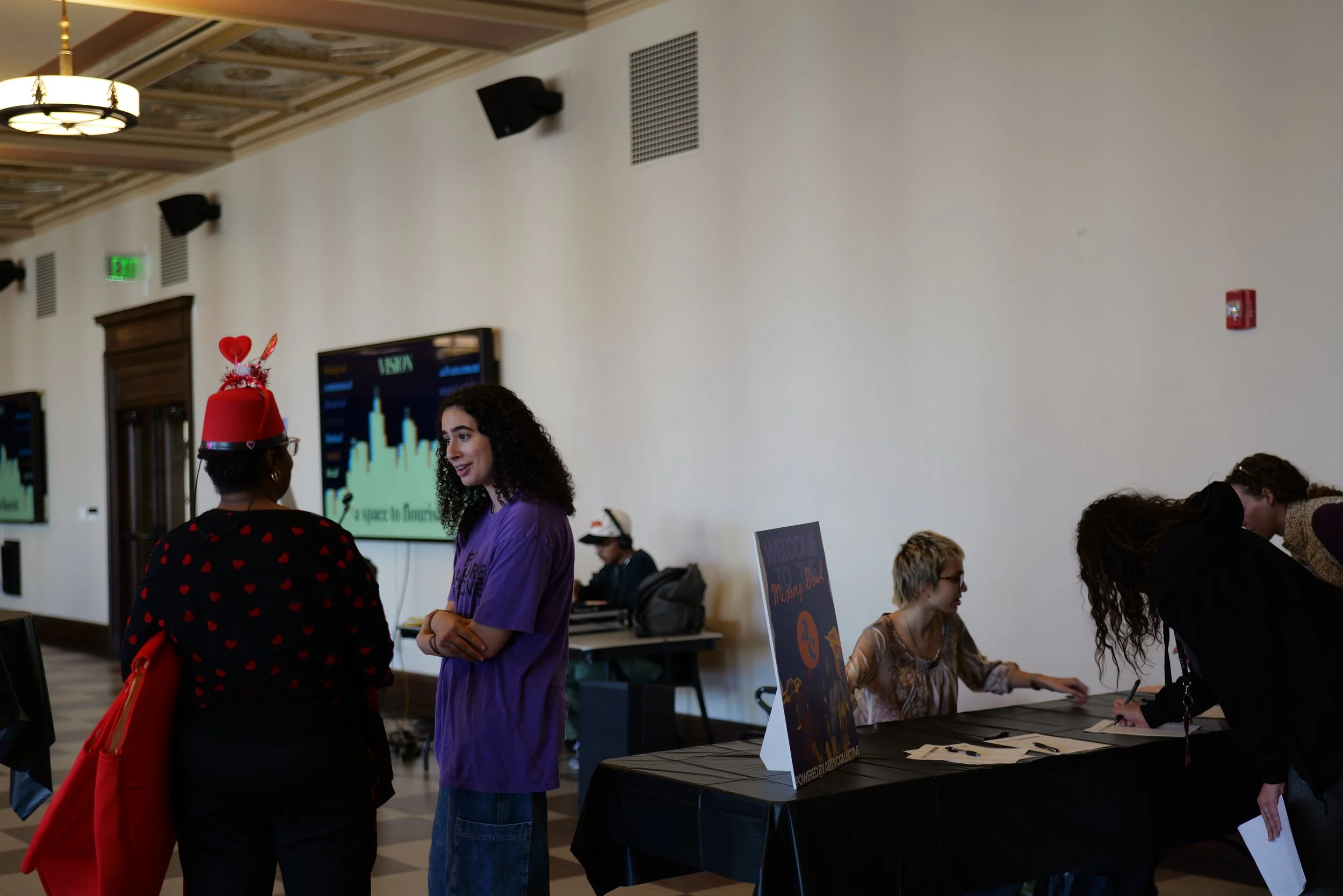 Participants arrive, check in, and begin connecting at a Mixing Bowl community gathering.