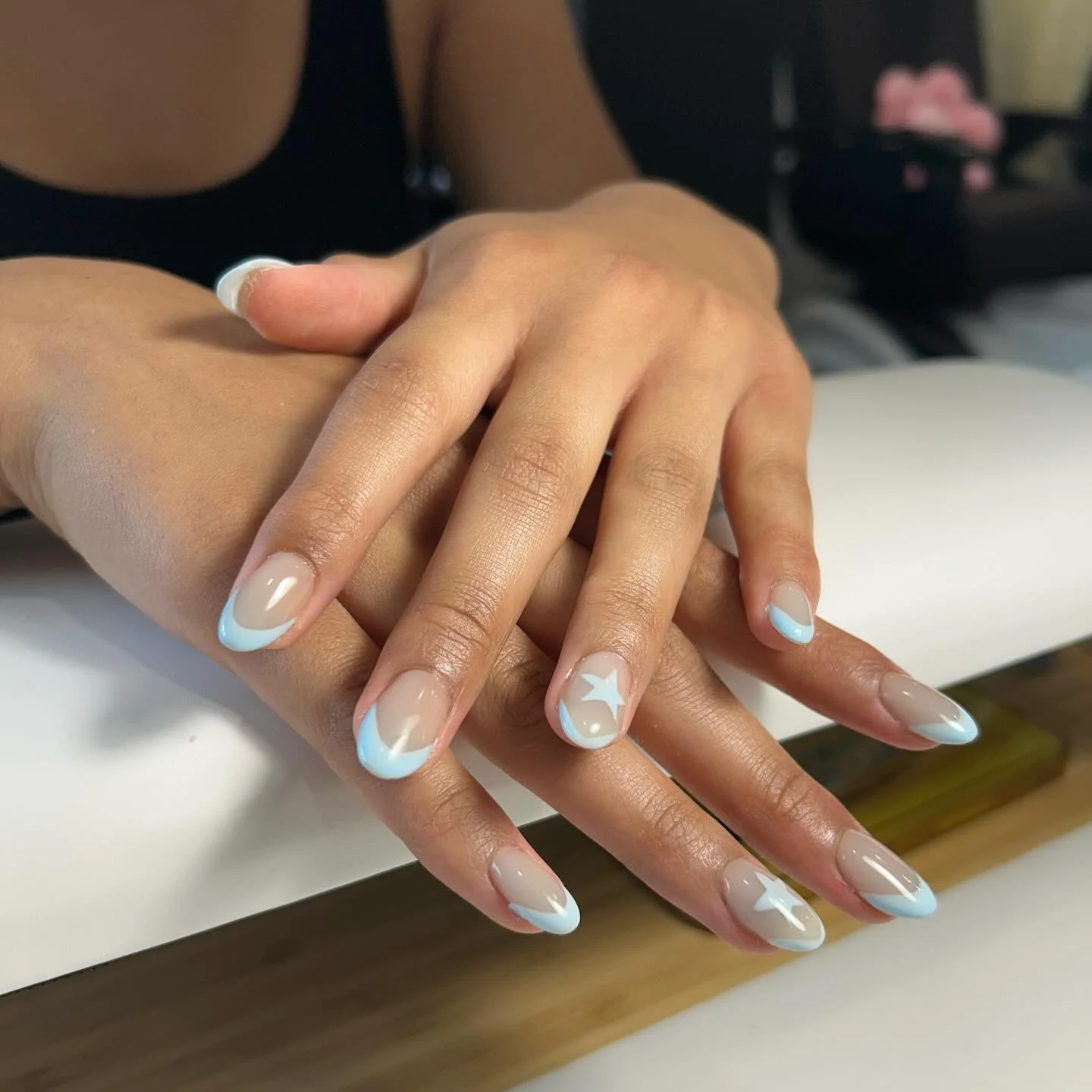 Tap into your star energy with these funky blue french tips ☆

TAP Hybrid Gel base with blue french tips and star designs