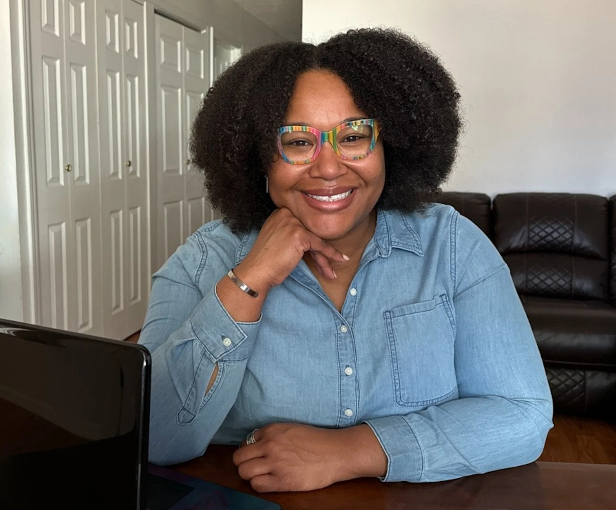 Photo of woman near laptop. Need a virtual assistant USA? Book a free consultation!