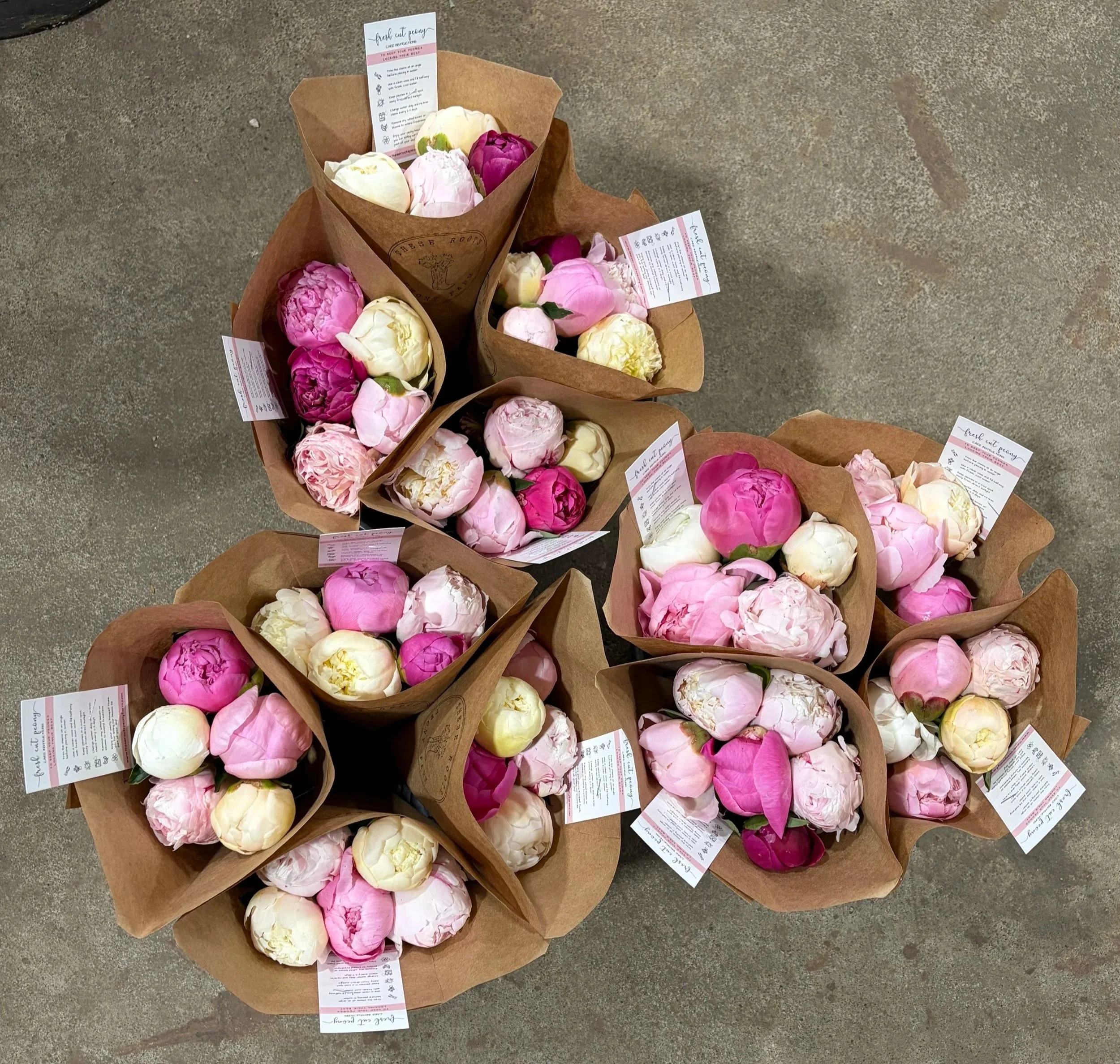 peony bouquets wrapped in craft paper