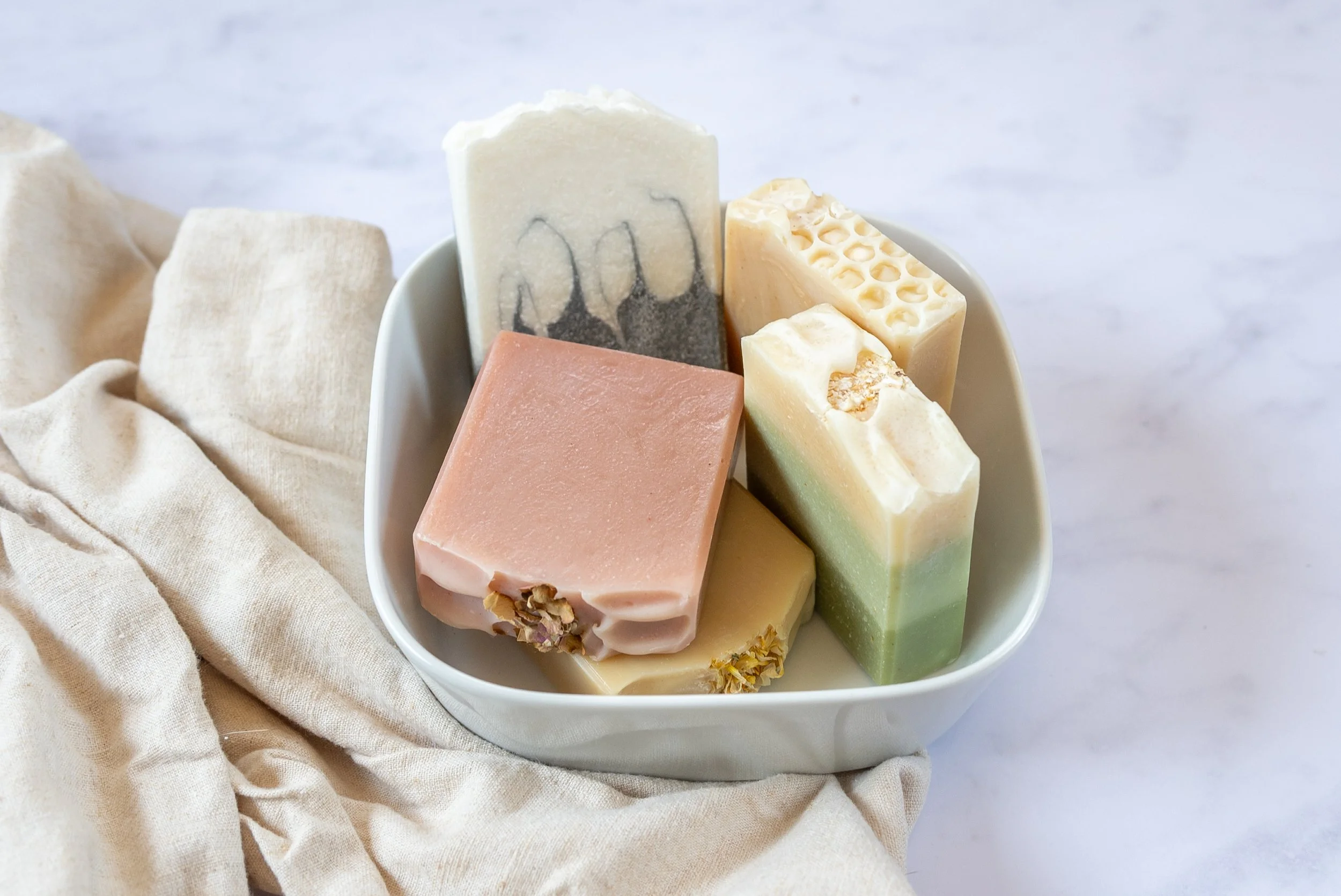 A bowl full of beautiful handmade soap bars