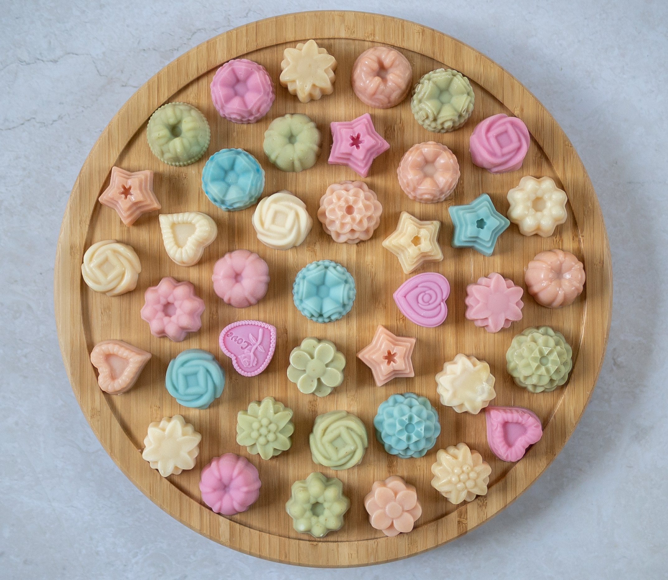 A tray with a election of mini colourful handmade soaps