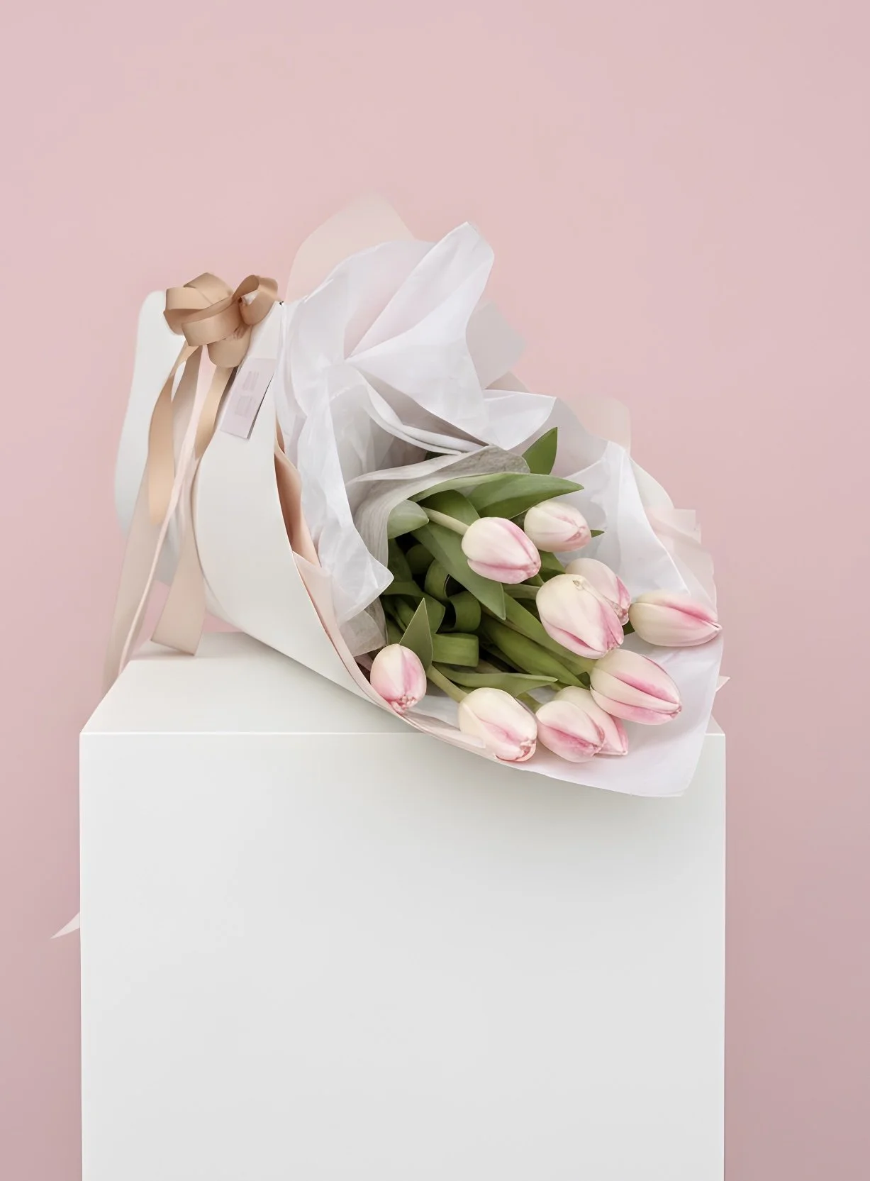 Tulip Carrier featuring fresh seasonal tulips arranged in a cardboard carrier by Adaia Flora