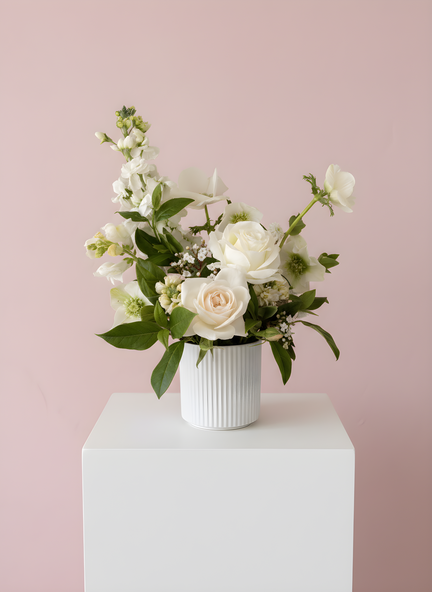 Thoughtful flower gift box from Hamilton florist Adaia Flora including a potted arrangement, soy candle, chocolate treats.