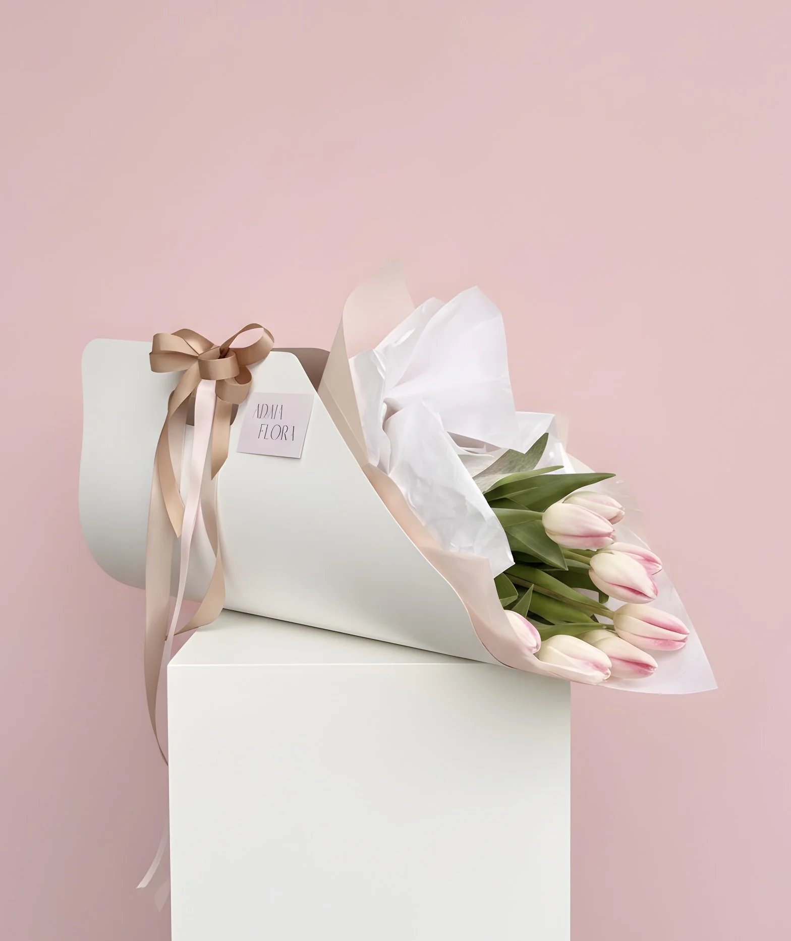 Front view of the Adaia Flora Tulip Carrier featuring a vibrant mix of premium tulips in a reusable cardboard flower carrier