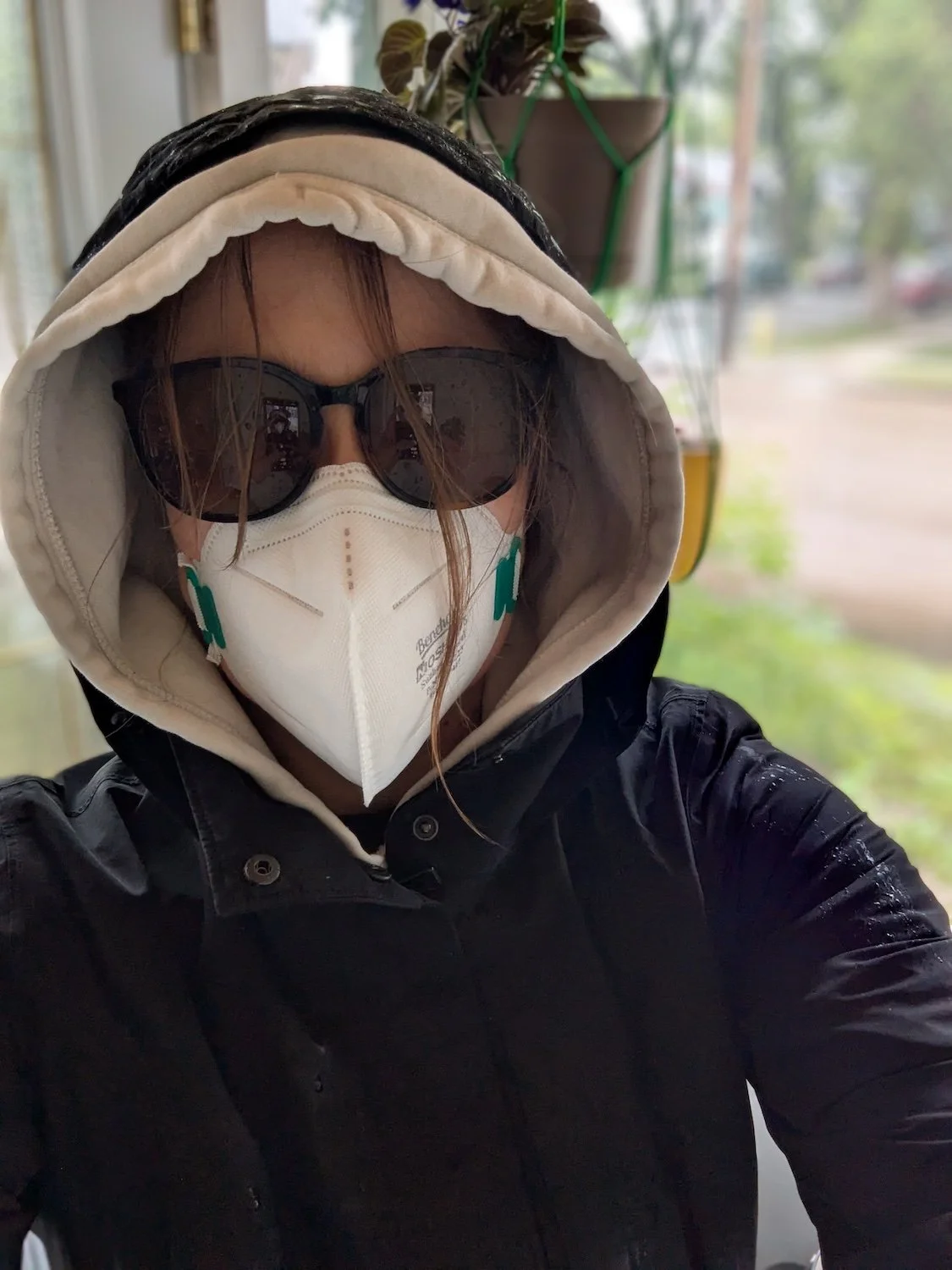  The author in gear for the walk to work in wildfire season: rain jacket (it’s also rainy), sunglasses, face mask. 
