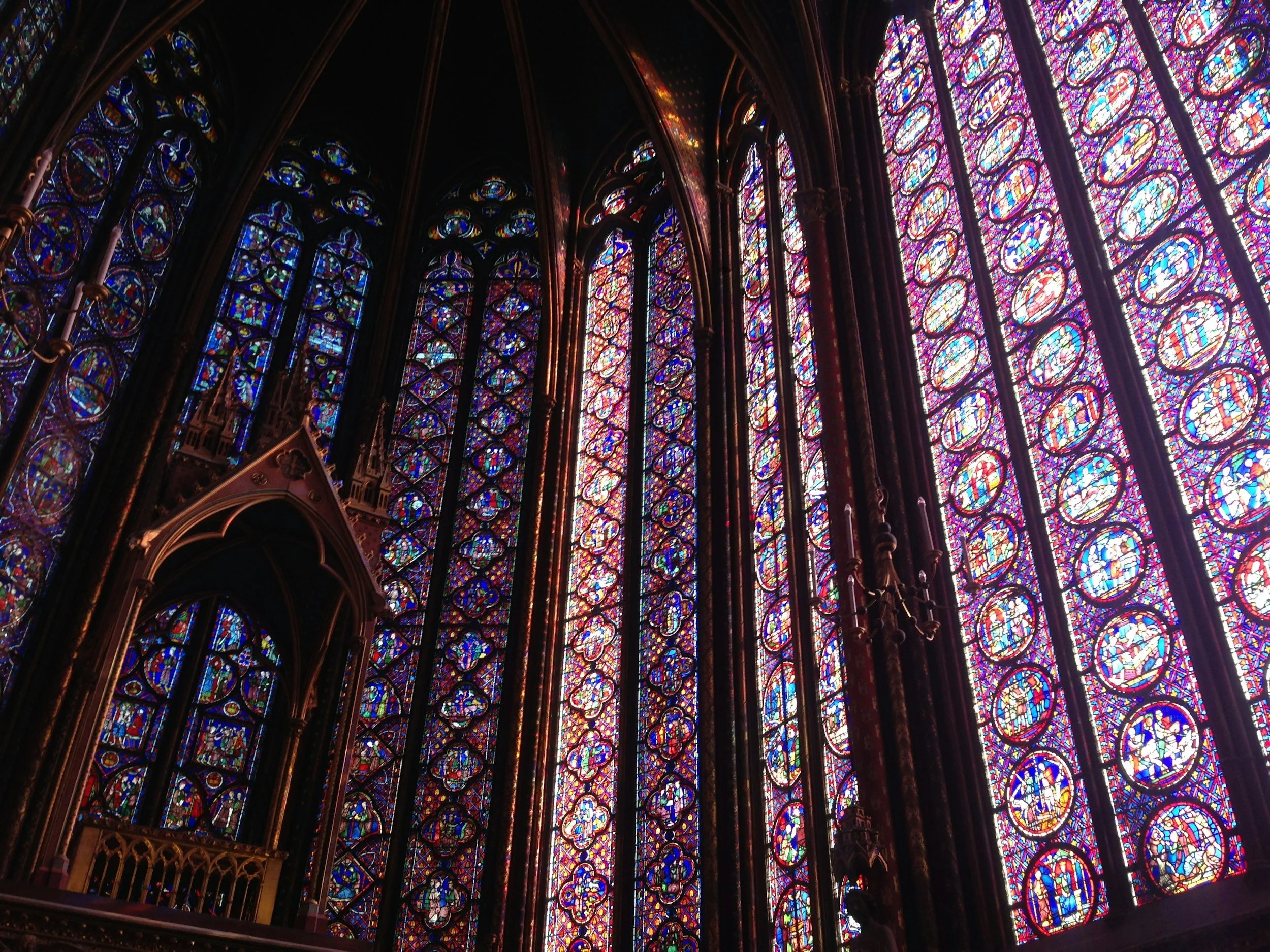 Colorful stained glass windows inside a cathedral.