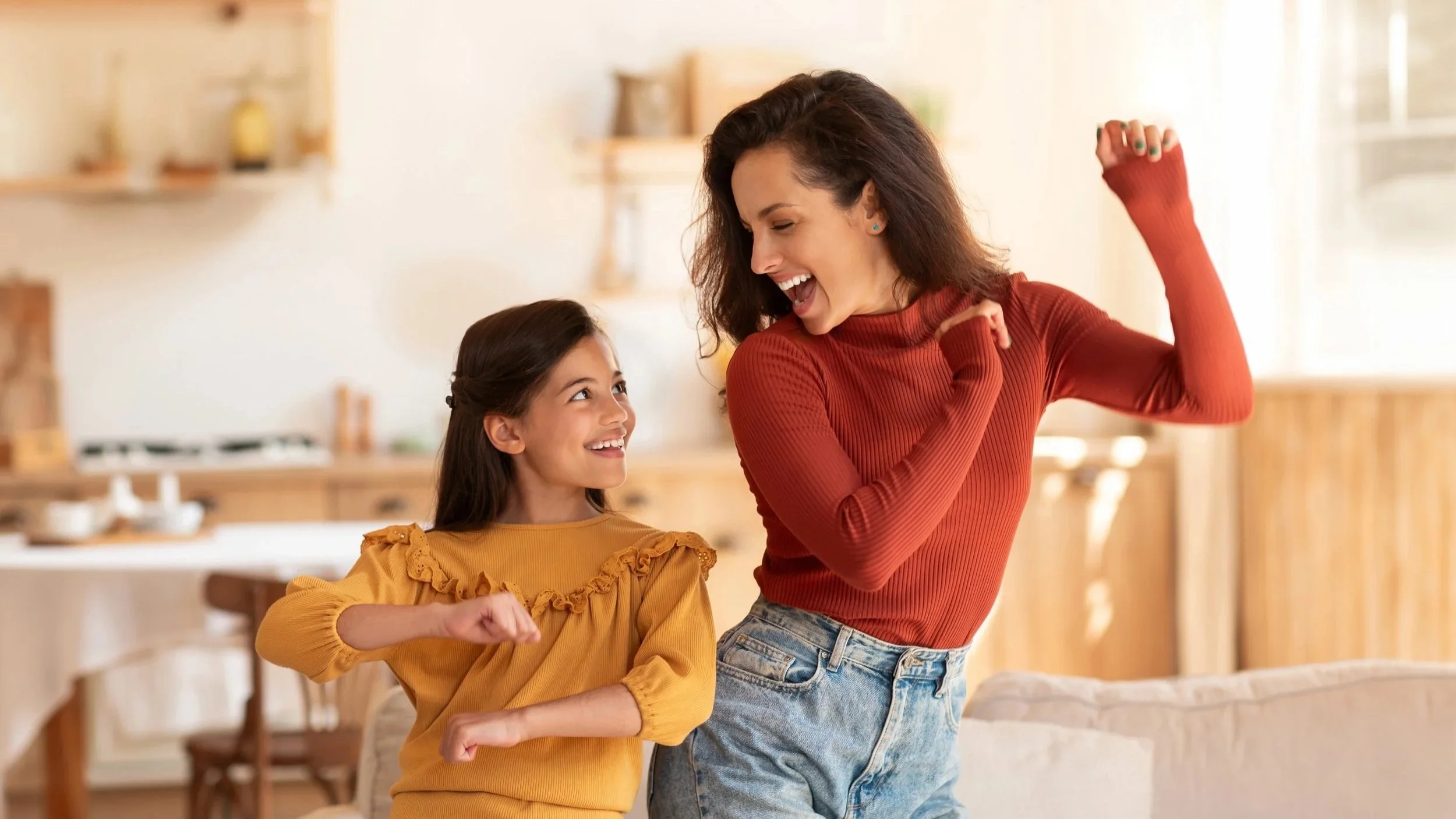 Parent and child warming up for a homeschool dance PE lesson at home