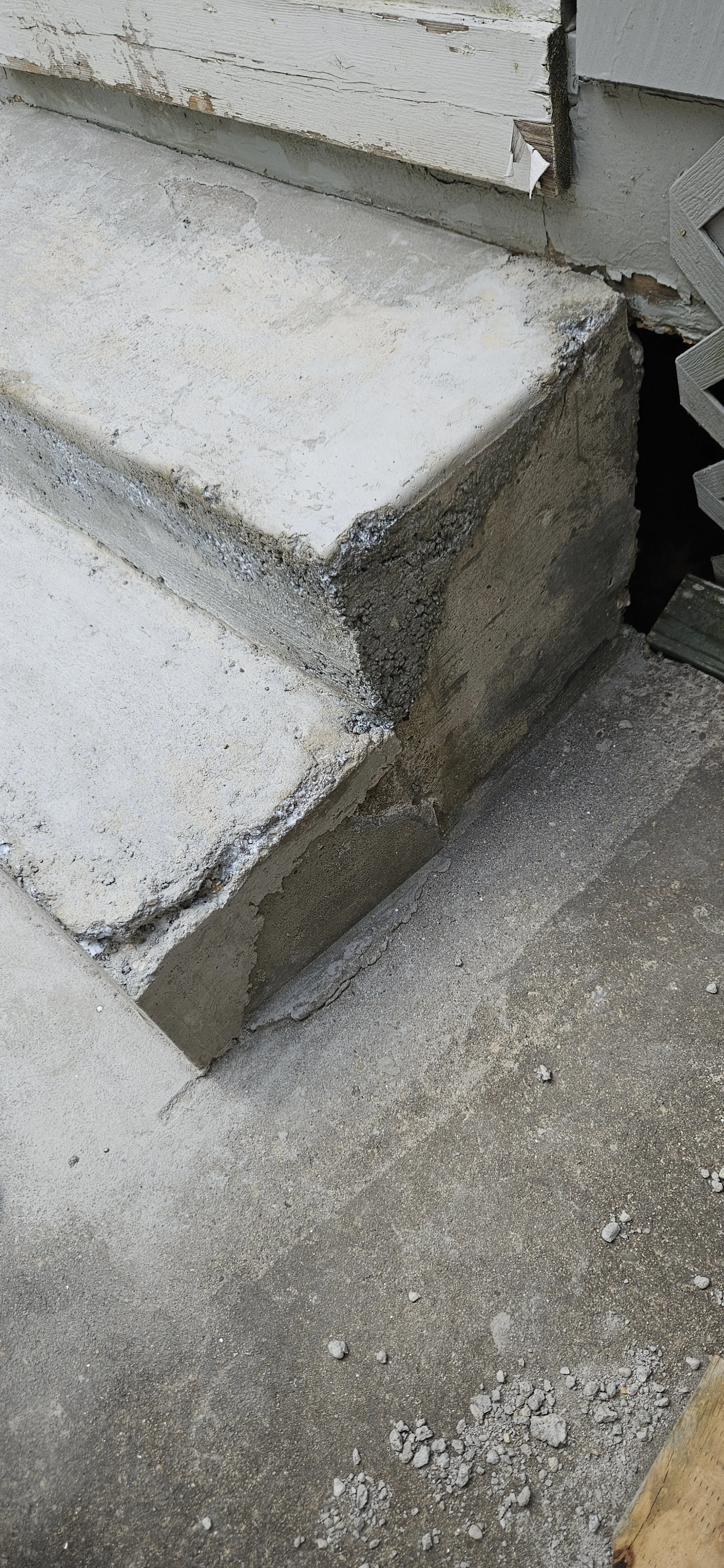 Some deep scoring on the corner to help the new concrete hold.