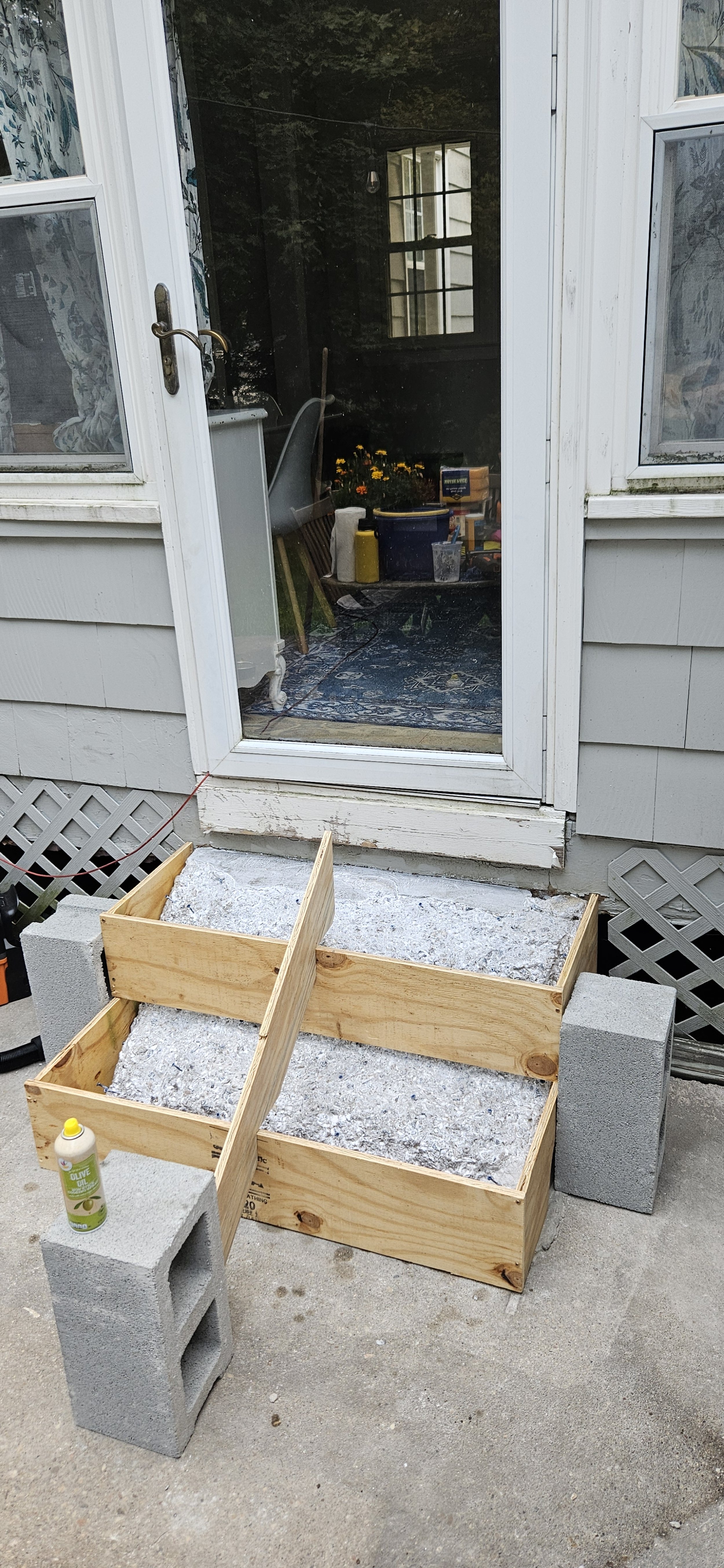 Plywood and cinderblocks for support.