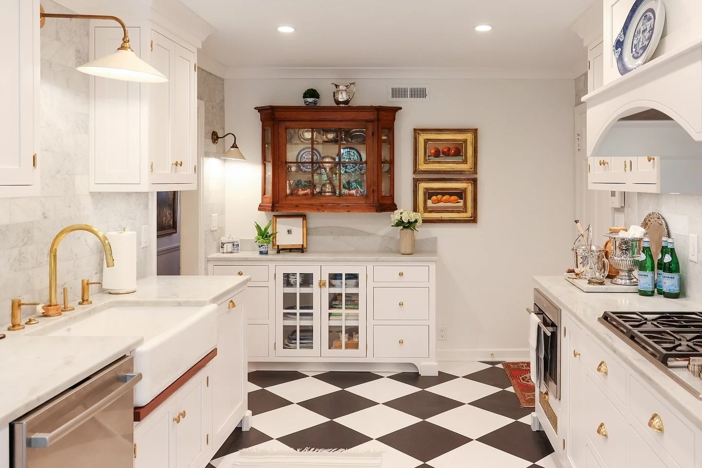 The details in this kitchen - from the checkered floor to scenic wallpaper - are so cozy. Powerful design makes you feel something. Something about this space just makes you feel better and at home.