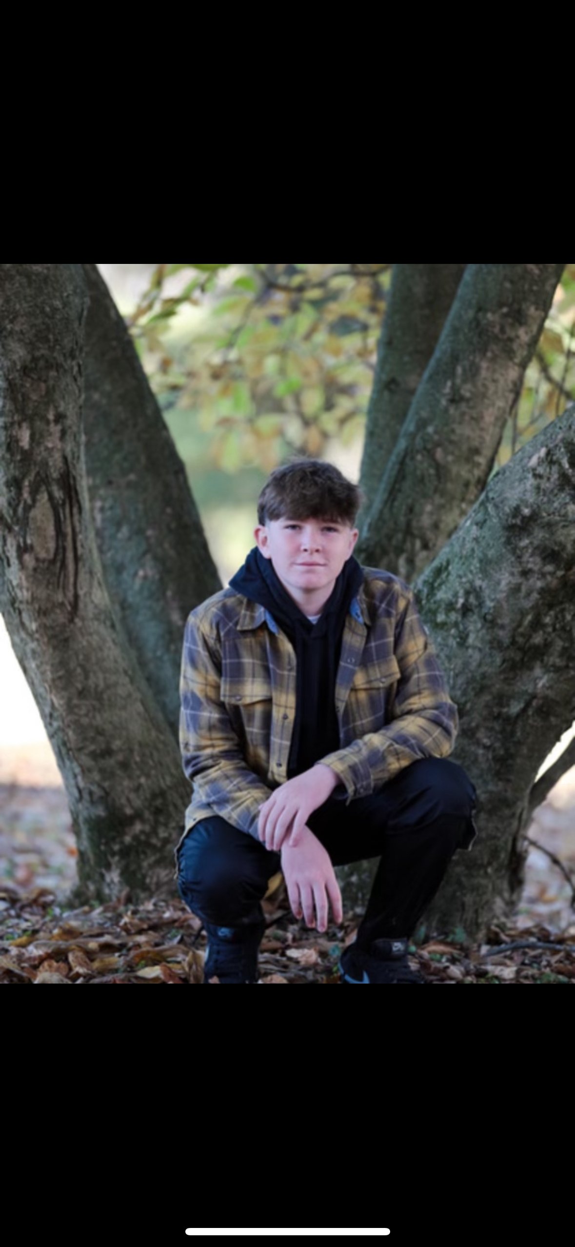 Silhouette of a person's head and shoulders against a light background.