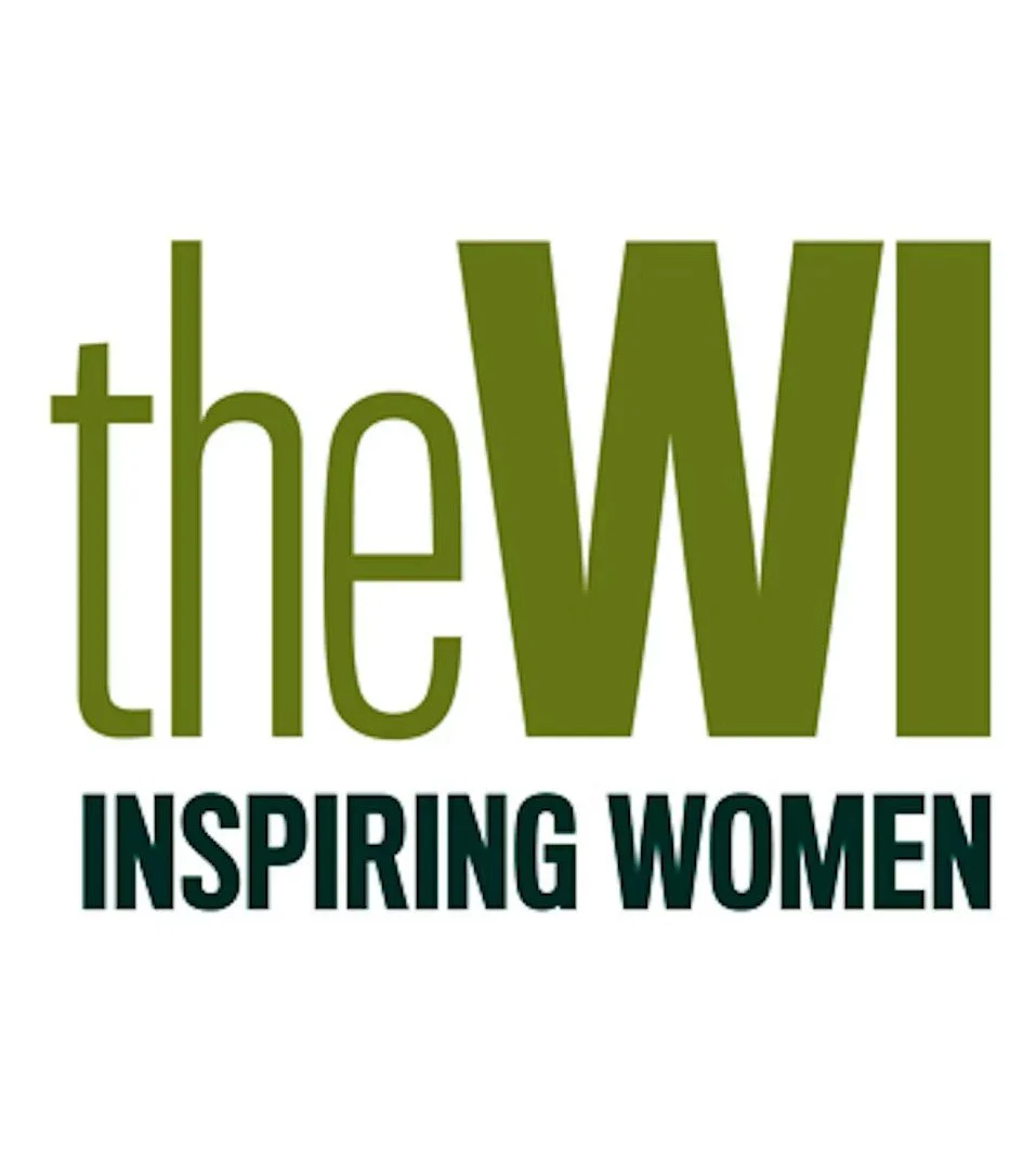 Logo with large green text 'the W' and smaller black text 'INSPIRING WOMEN' underneath