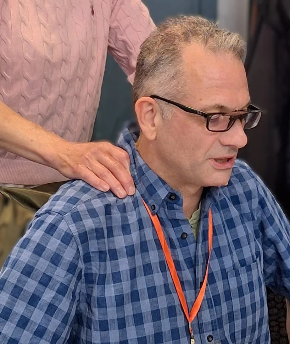 Shoulder massage on man with glasses